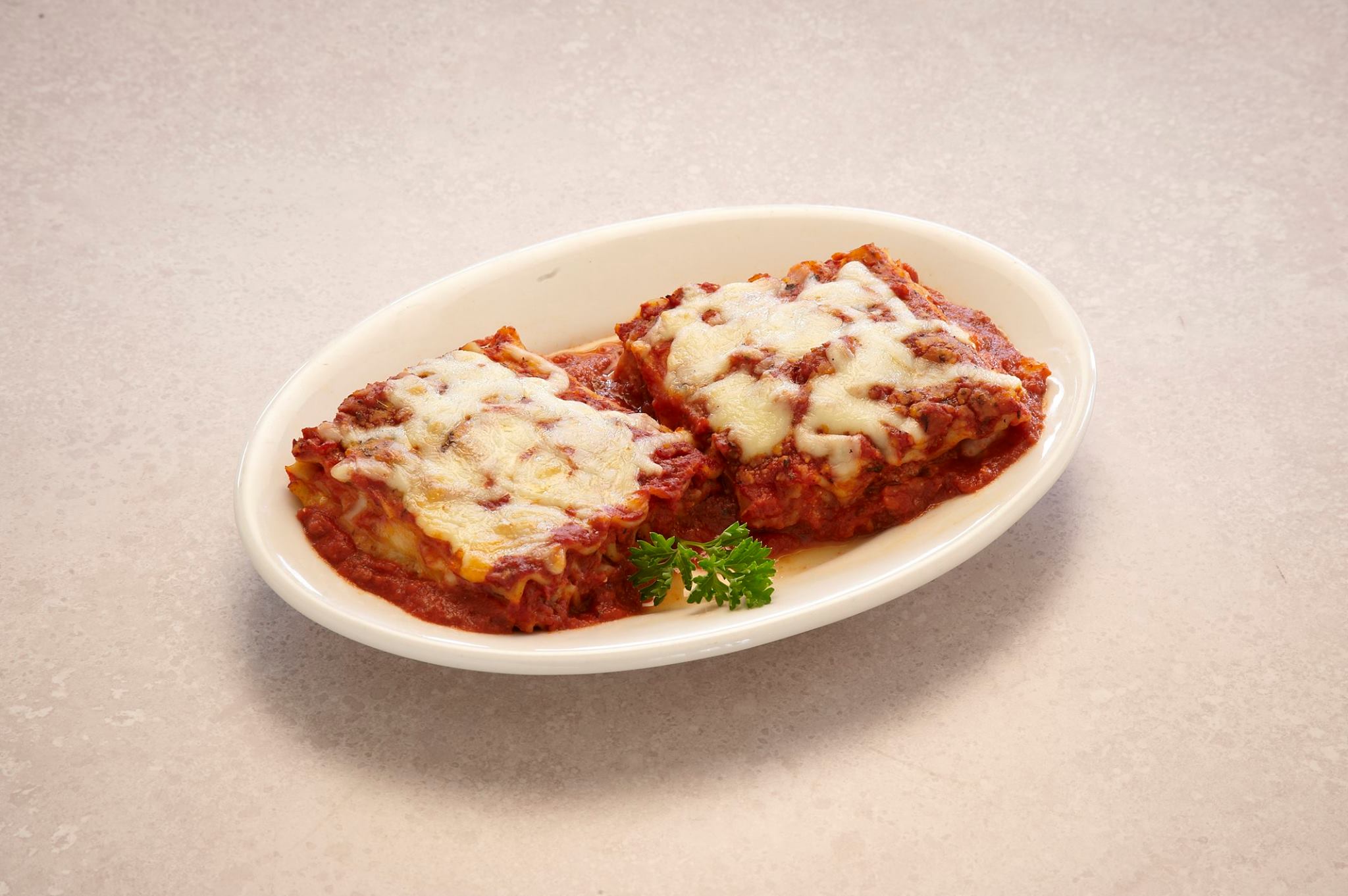 Order Baked Lasagna Pasta food online from Imo's Pizza store, Webster Groves on bringmethat.com