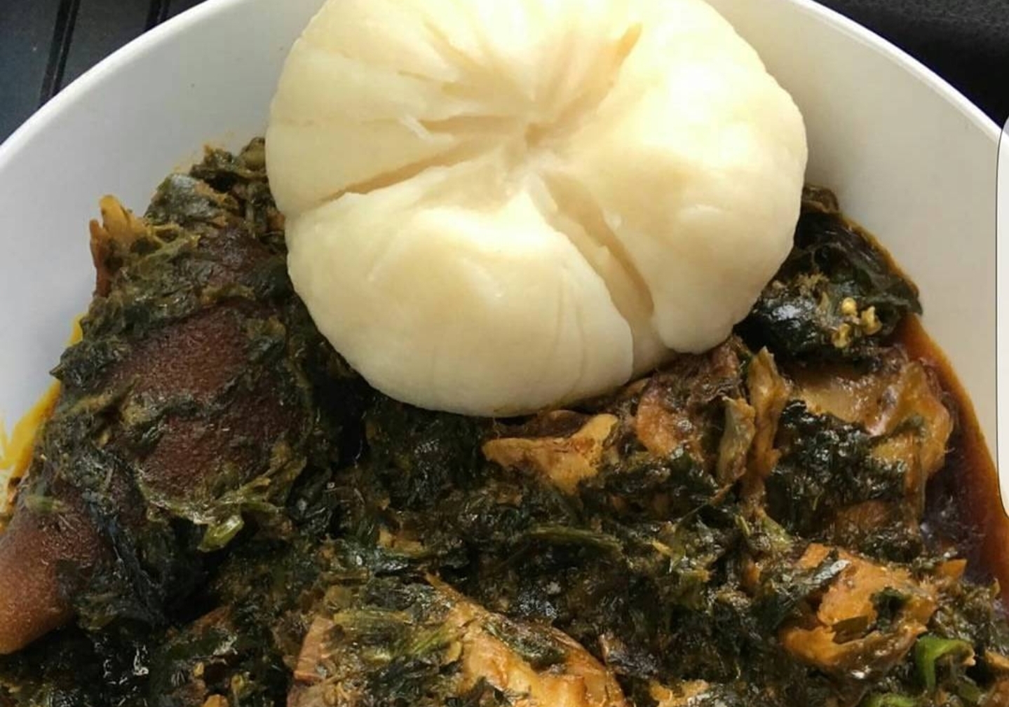 Order Afang Soup & Pounded Yam Fufu  food online from Intercontinental Restaurant store, Columbus on bringmethat.com
