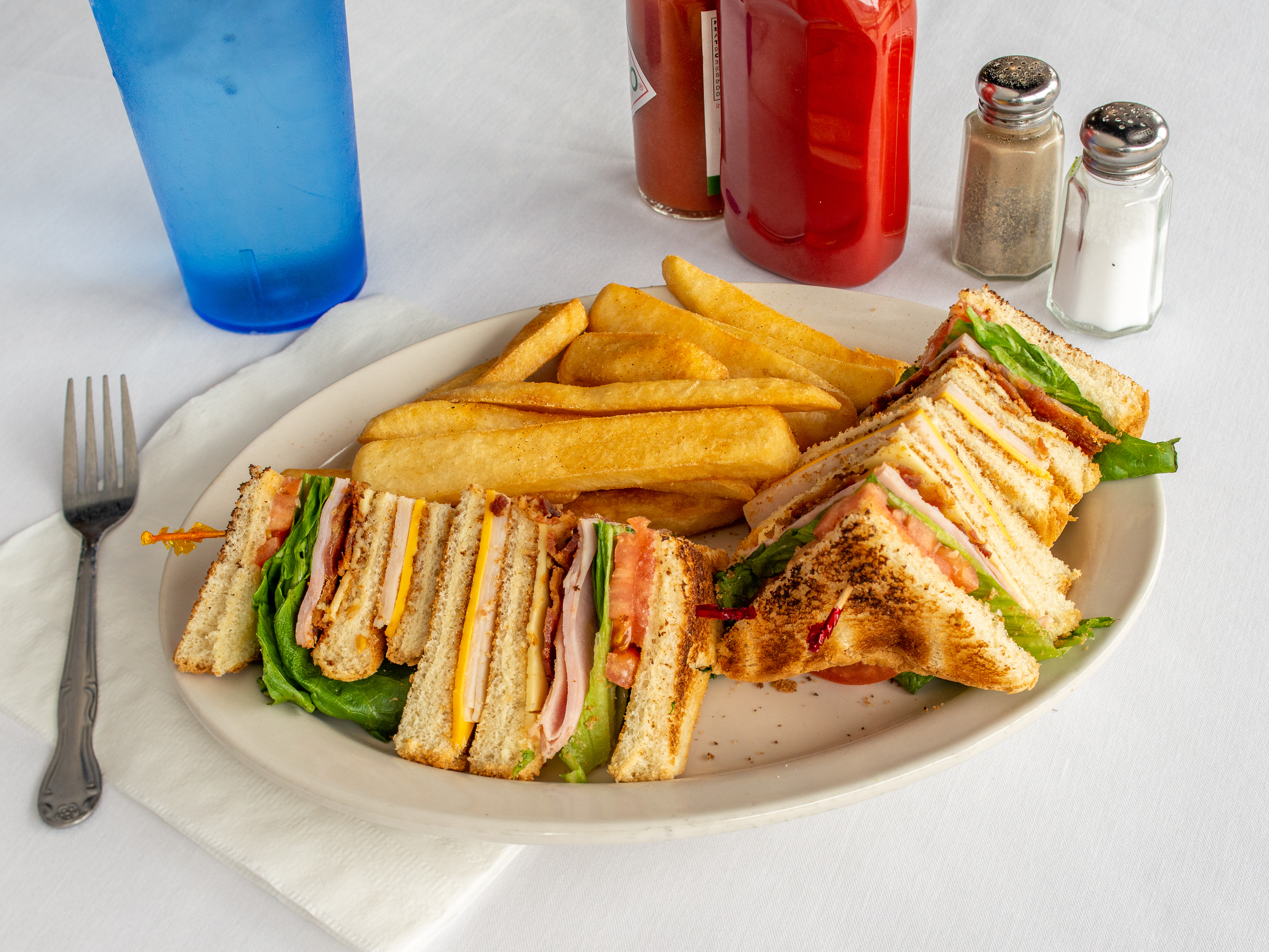 Order Club Sandwich W/Fries or Chips food online from Good Day Cafe store, Arlington on bringmethat.com