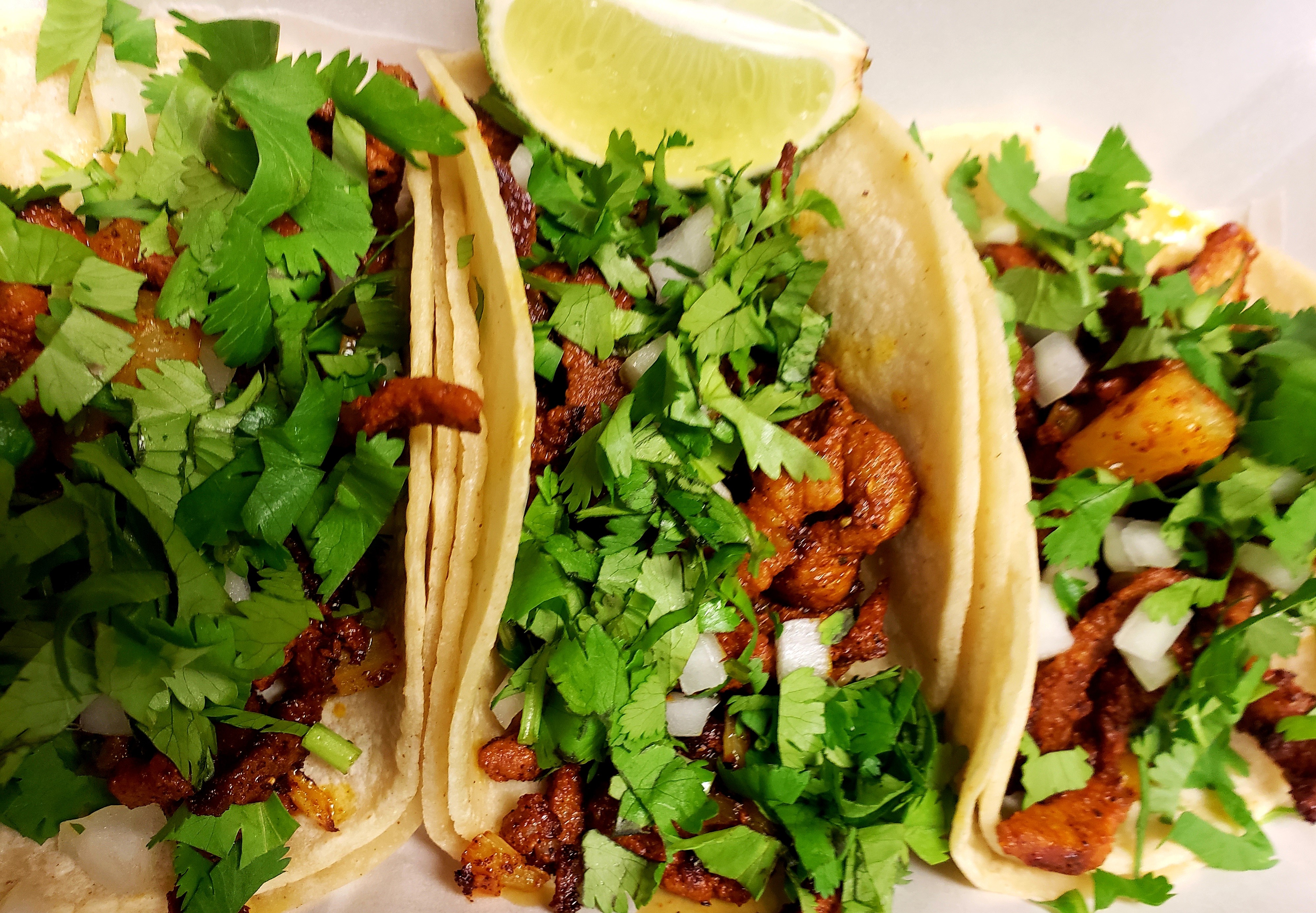 Order Al Pastor Tacos food online from Quetzally Mexican Food store, Philadelphia on bringmethat.com
