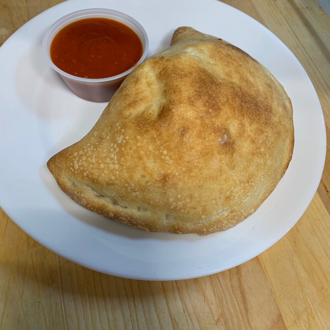 Order One Filling Calzone - Calzone food online from Davila's Pizza & Restaurant store, Hackettstown on bringmethat.com