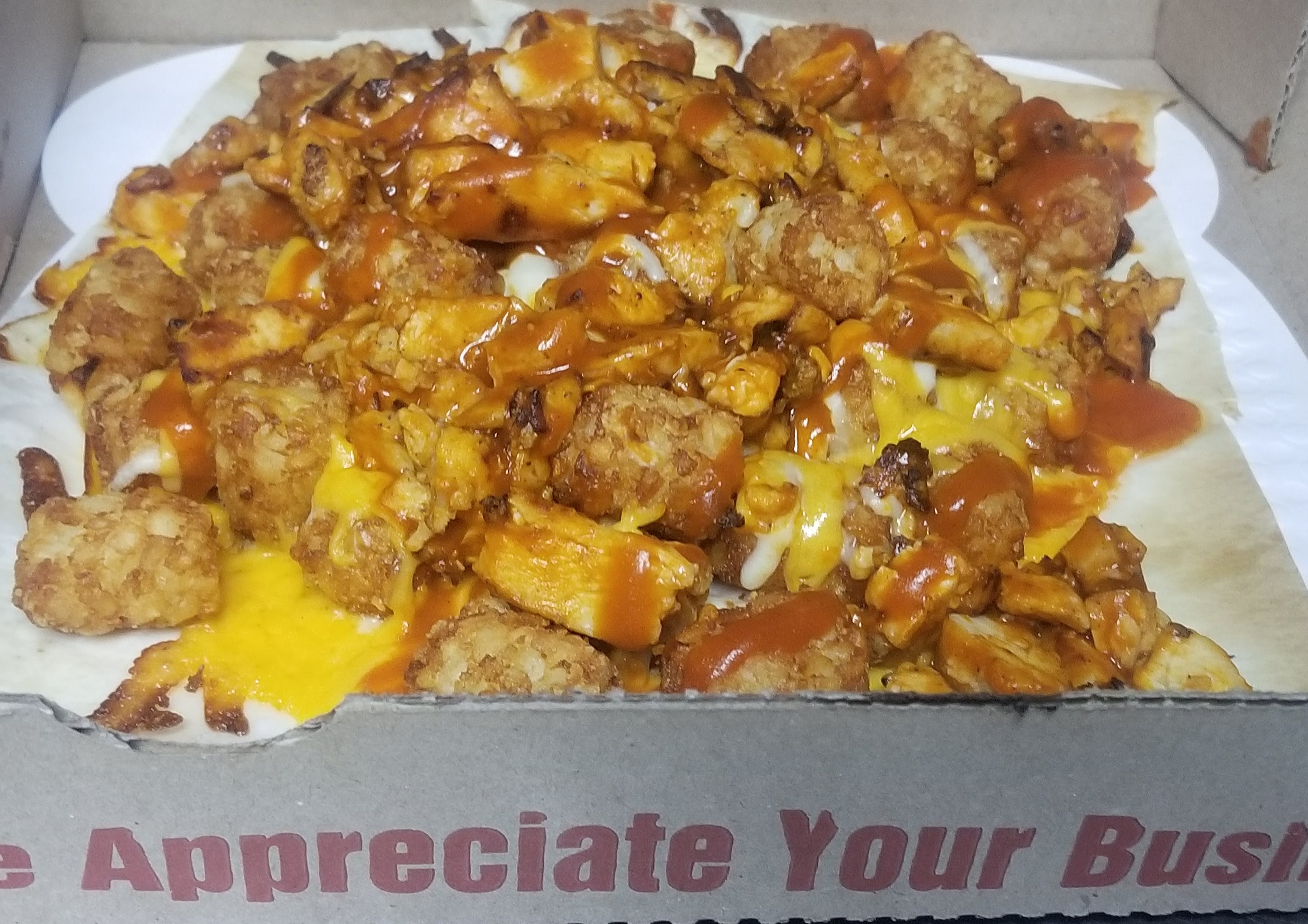 Order Buffalo Chicken Tater Tots - Regular food online from Novotny's Groceries & Pizza store, Worthington on bringmethat.com