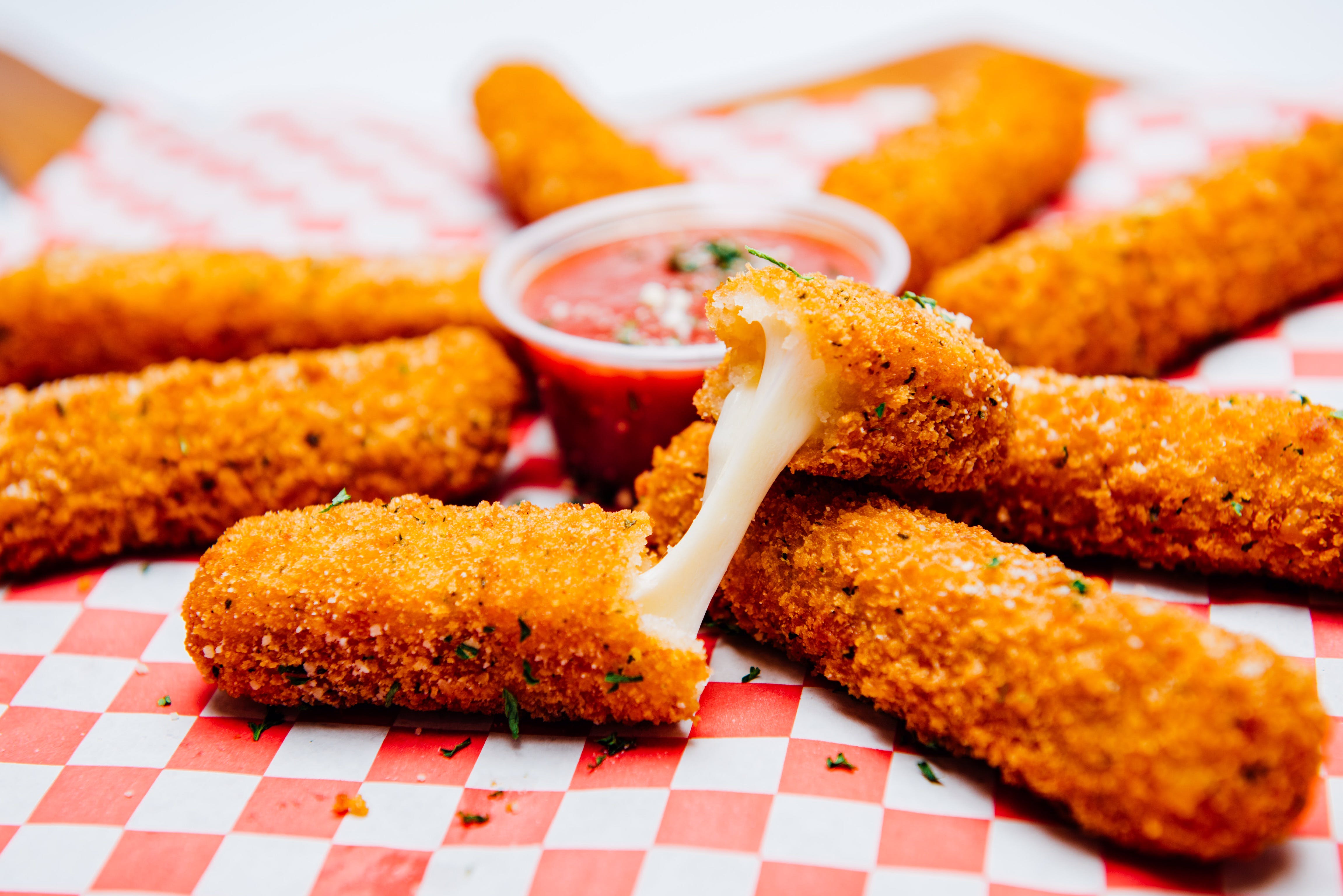 Order Mozzarella Sticks - 8 Pieces food online from California Pizza Place store, Anaheim on bringmethat.com
