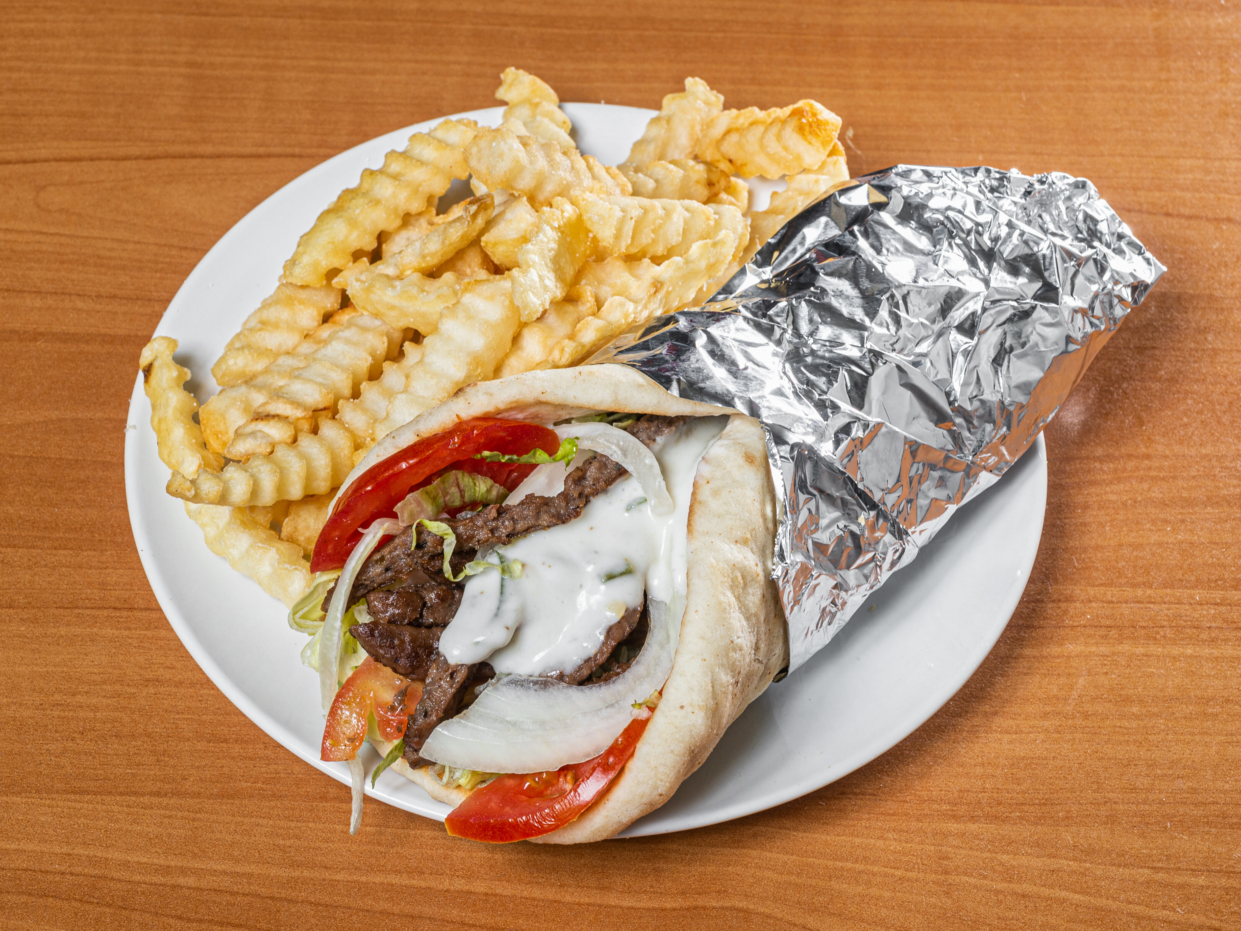 Order Gyro Wrap food online from Famous Phillys Cheesesteak store, Clayton on bringmethat.com