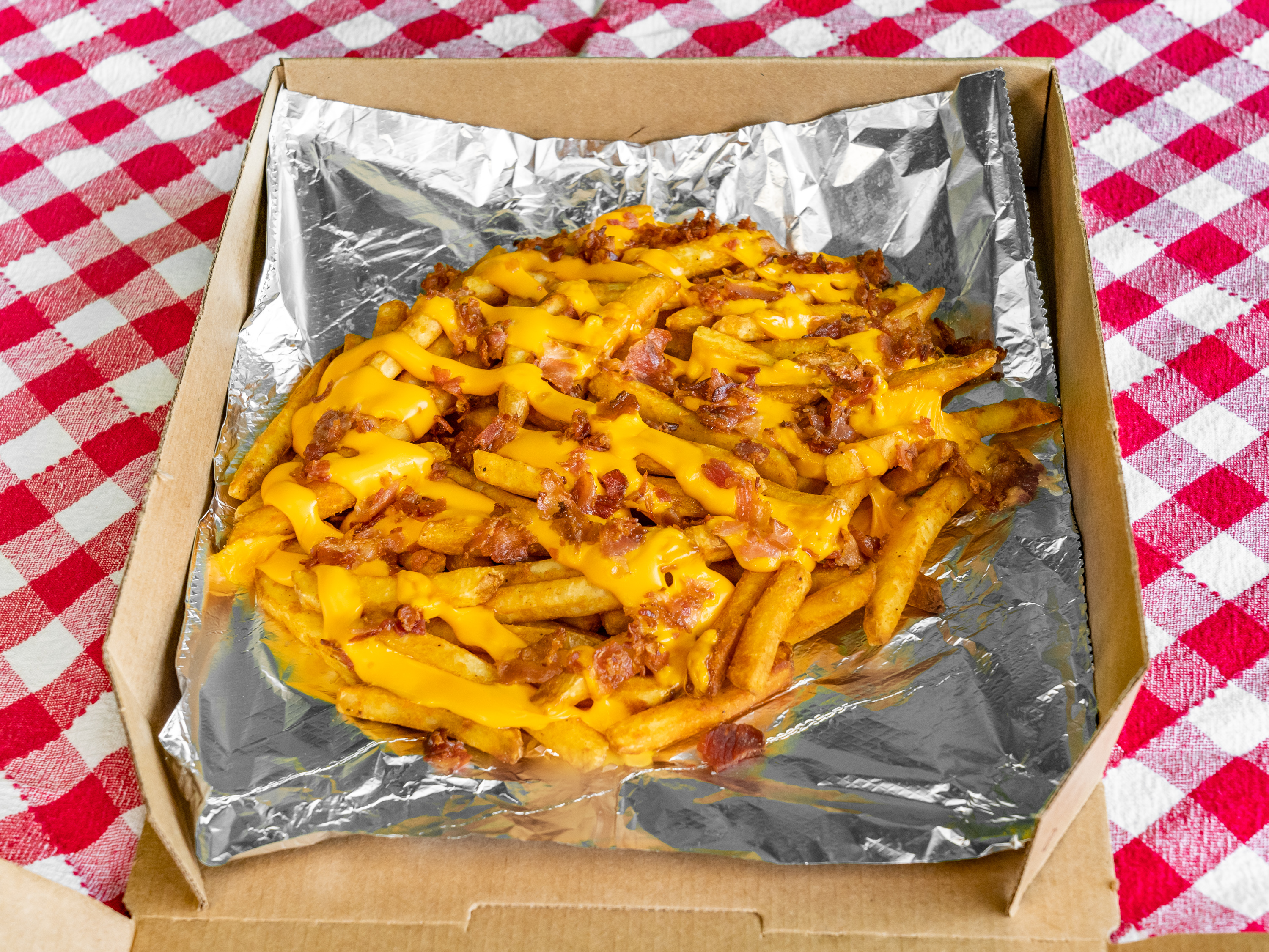 Order Cheesy Bacon Fries food online from What Up Dough Pizzeria store, Utica on bringmethat.com
