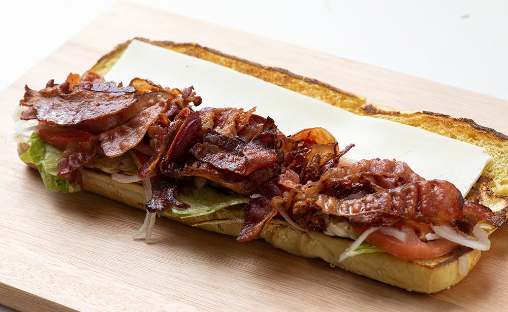 Order BLT Sub - Half food online from Calz Pizza store, Norfolk on bringmethat.com