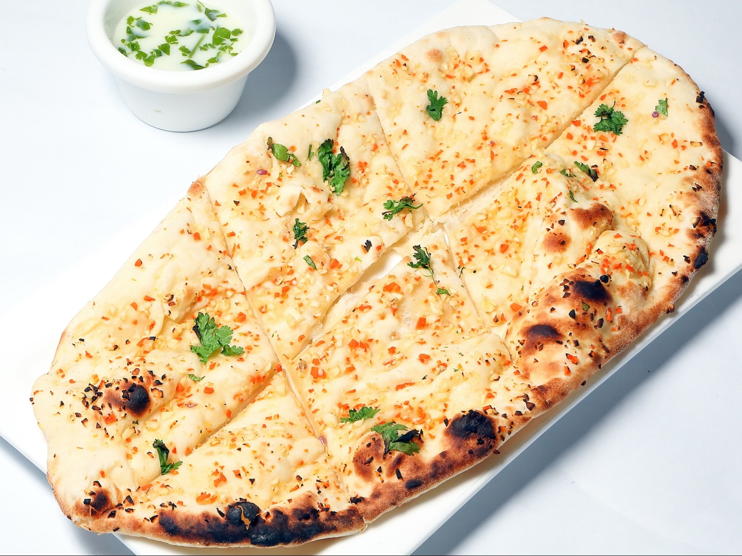 Order BUTTER GARLIC NAAN food online from Naan-Tastic store, Rochester on bringmethat.com