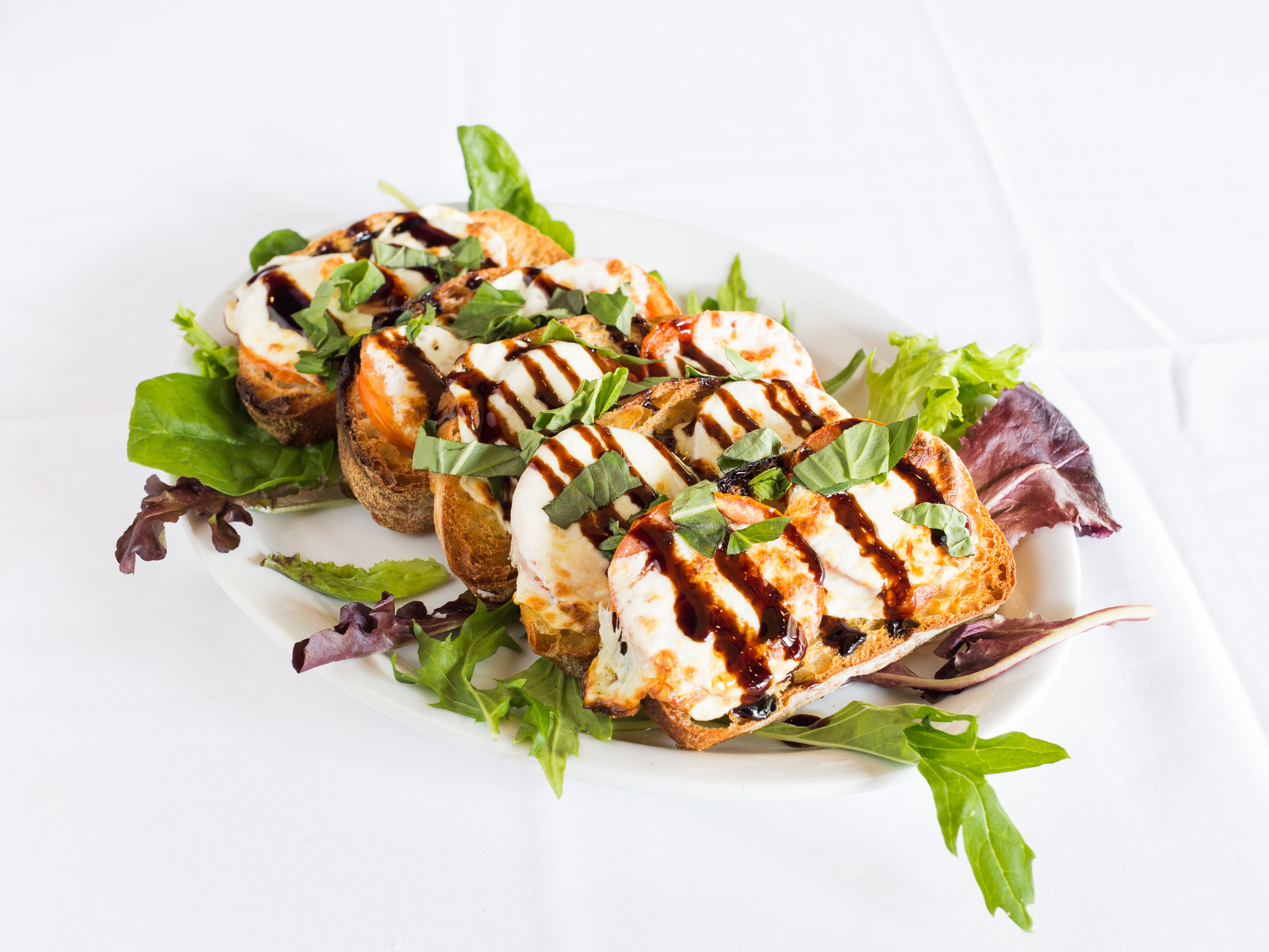 Order Baked Caprese food online from Trio A Brick Oven Cafe store, Greenville on bringmethat.com