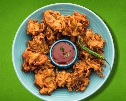 Order Onion Poppers food online from Plant-Based Indian store, Fort Collins on bringmethat.com
