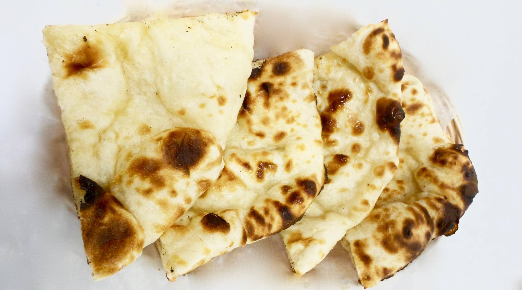 Order Naan food online from India Cafe store, White Plains on bringmethat.com
