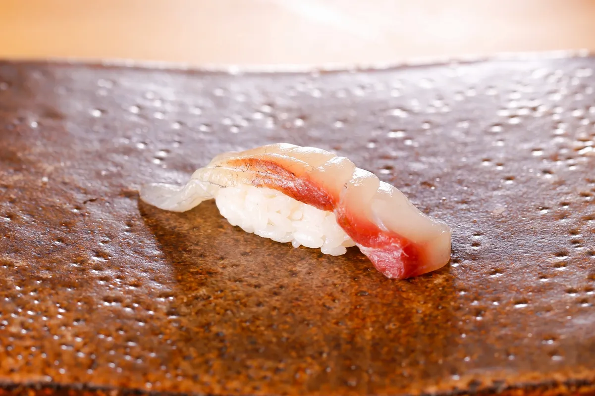 Order Hamachi Nigiri food online from Bento Revolving Sushi store, Fair Oaks on bringmethat.com
