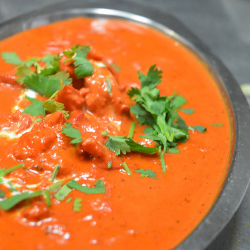 Order Butter Chicken food online from Cosmos Indian Cafe store, Lawrence on bringmethat.com