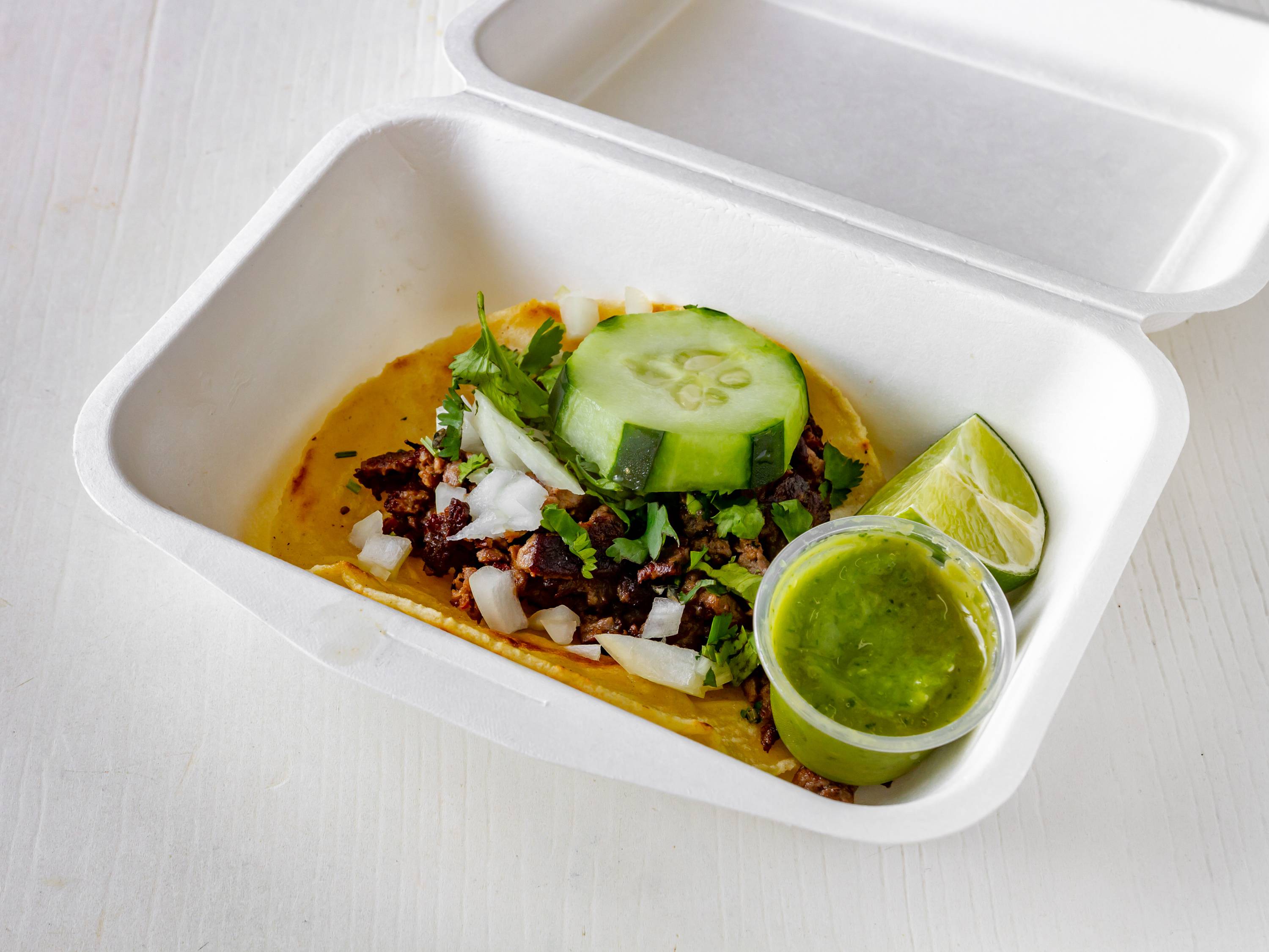 Order 2. Tacos de Carne food online from Diner Latino Pupuseria store, Middle River on bringmethat.com