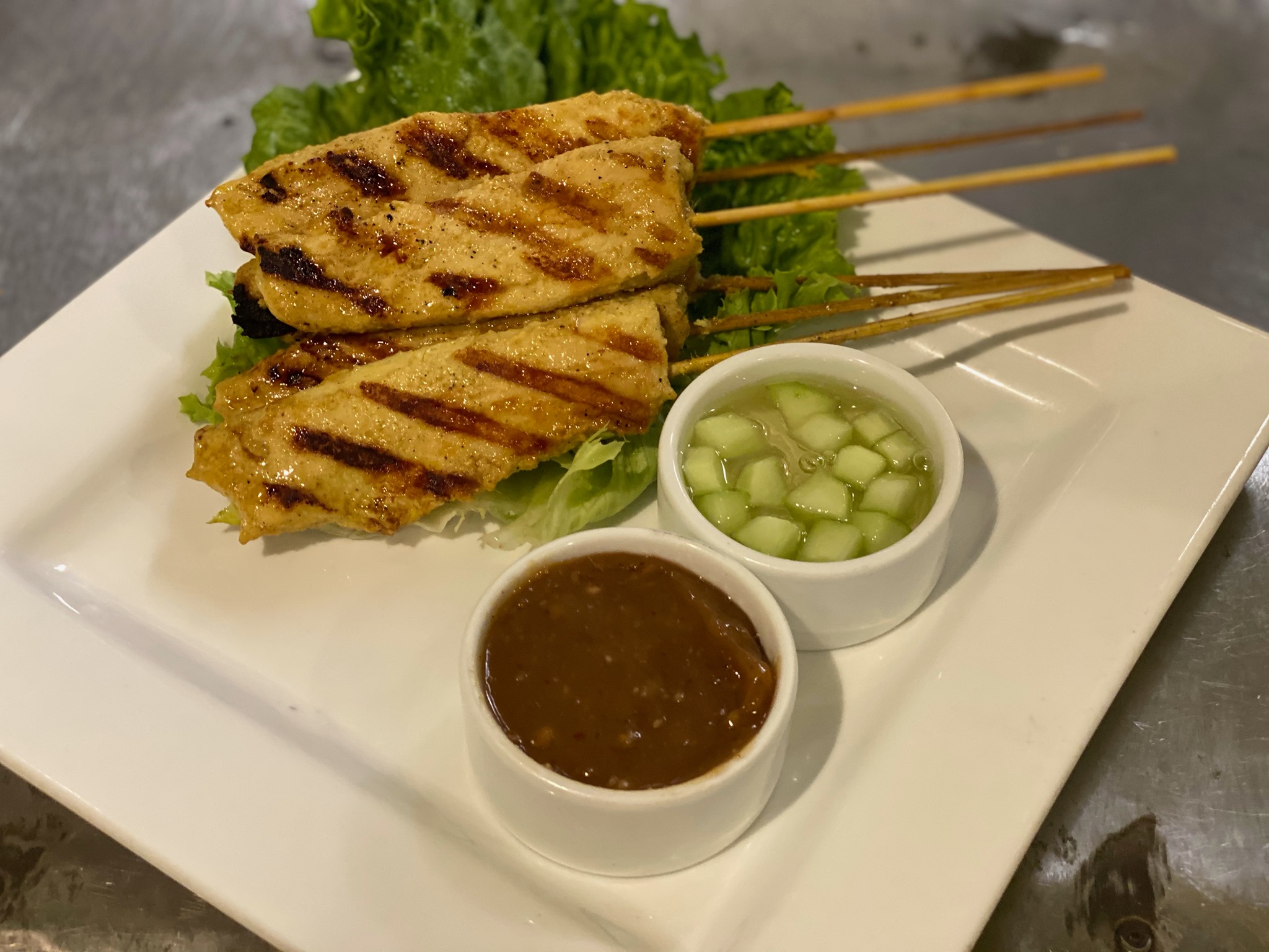 Order 8. Chicken Satay food online from Thai Orchid store, Charlotte on bringmethat.com