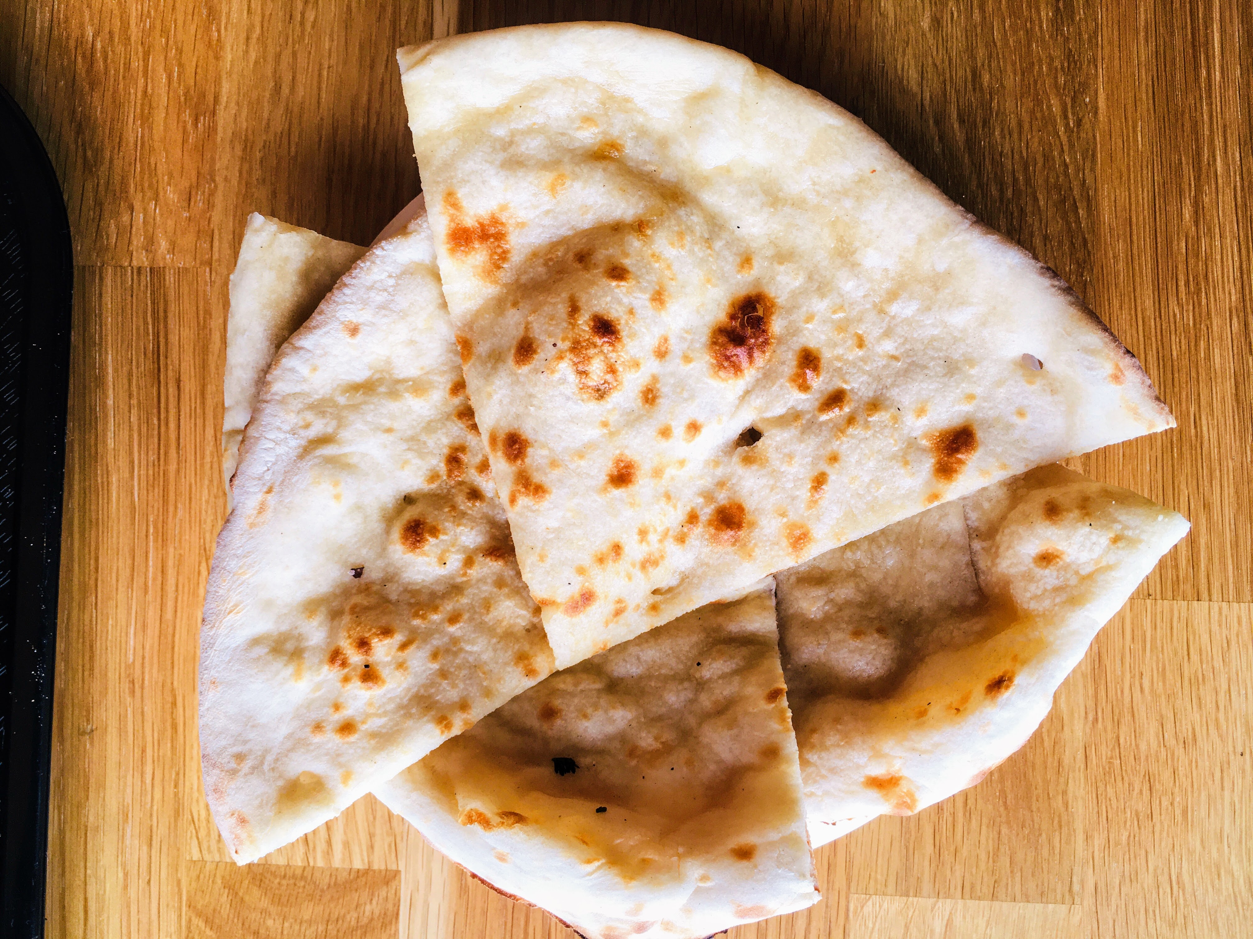 Order Butter Naan food online from Manchurian Indian Cuisine store, West Sacramento on bringmethat.com
