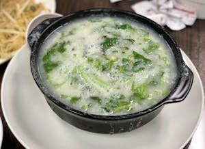 Order 12. Watercress Salted Egg Congee-西洋菜双蛋粥 food online from Tasty Cafe Restaurant store, Davie on bringmethat.com