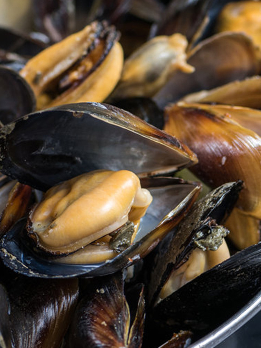 Order (L) Black Mussels food online from Rubys Cajun store, Cherry Hill on bringmethat.com