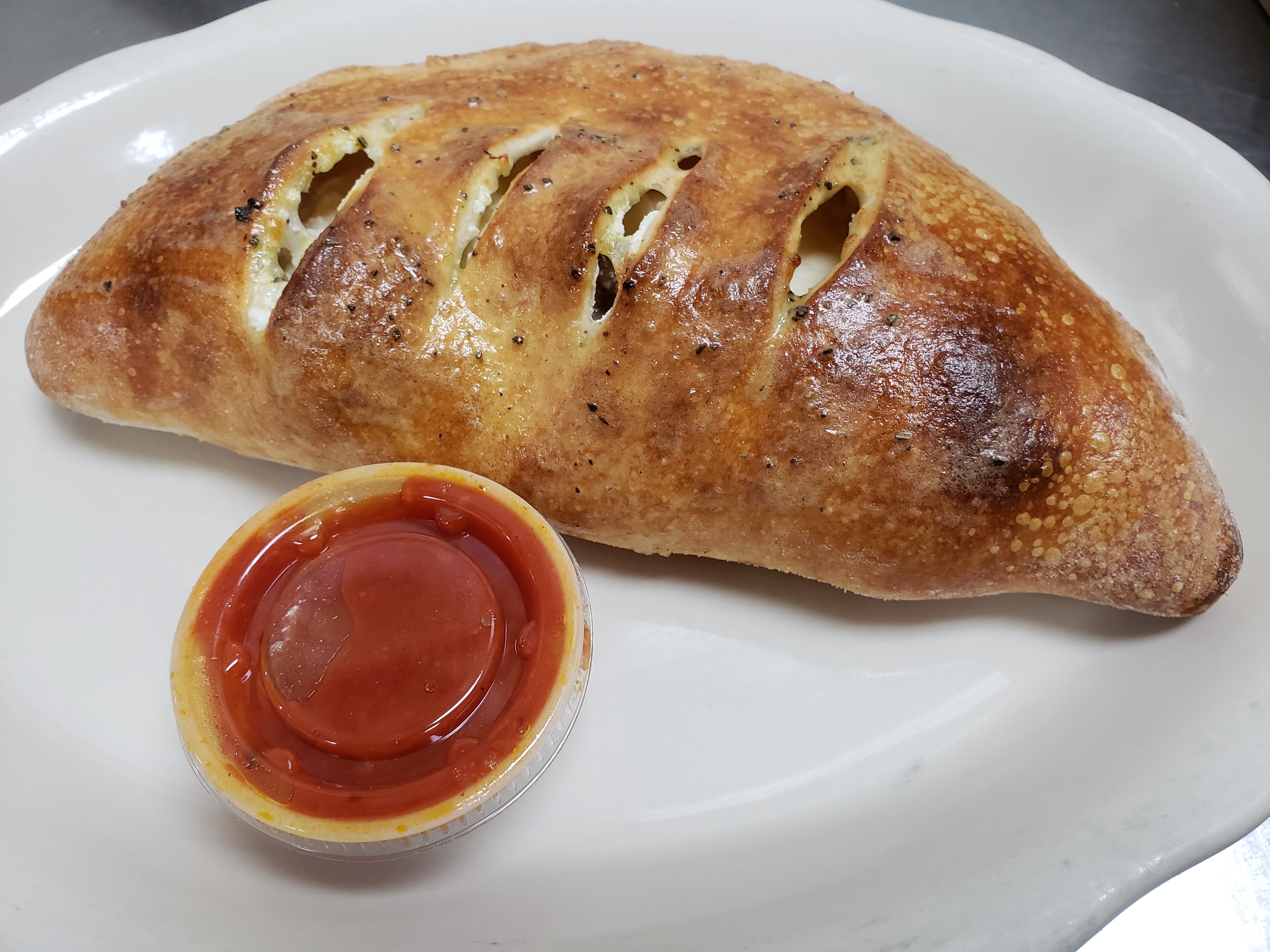 Order Ham Calzone food online from Illianos Pizza store, Clemmons on bringmethat.com
