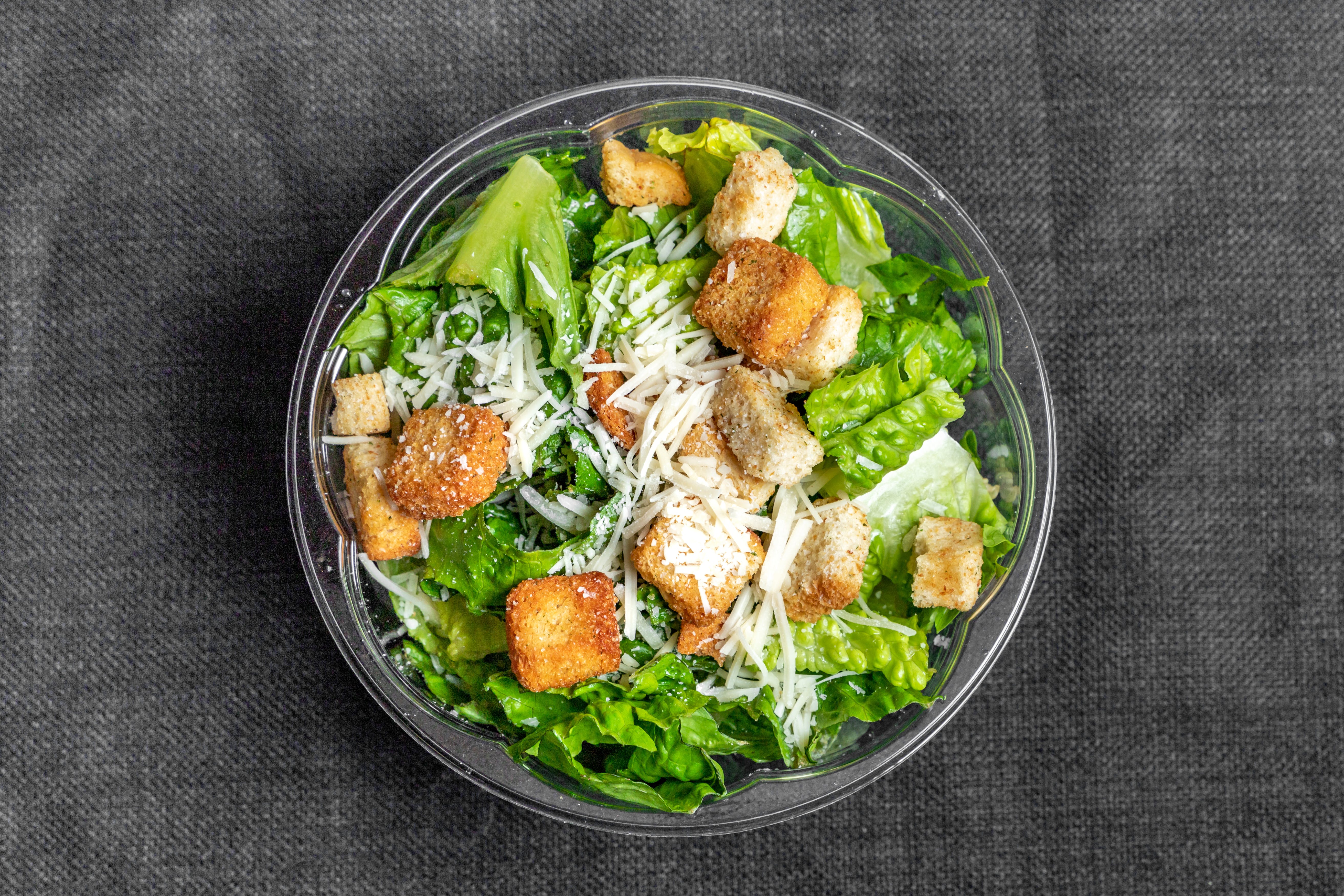 Order Caesar Salad - Large food online from Primos restaurant store, Boston on bringmethat.com