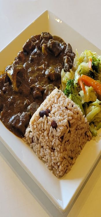Order Curry Goat food online from Paradise Place Jamaican Cuisine store, Las Vegas on bringmethat.com