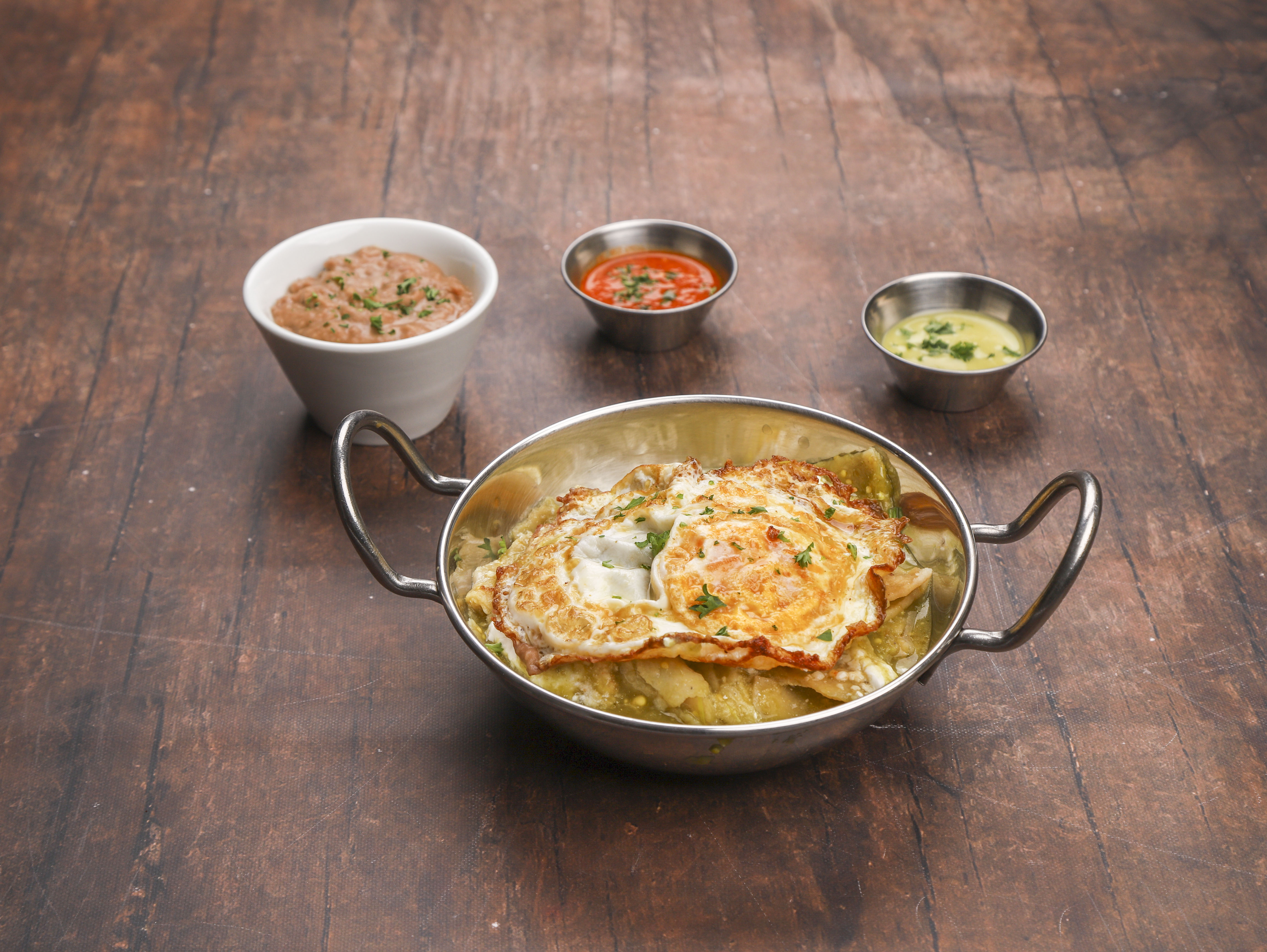 Order Chilaquiles food online from Taqueria Taxco store, Dallas on bringmethat.com