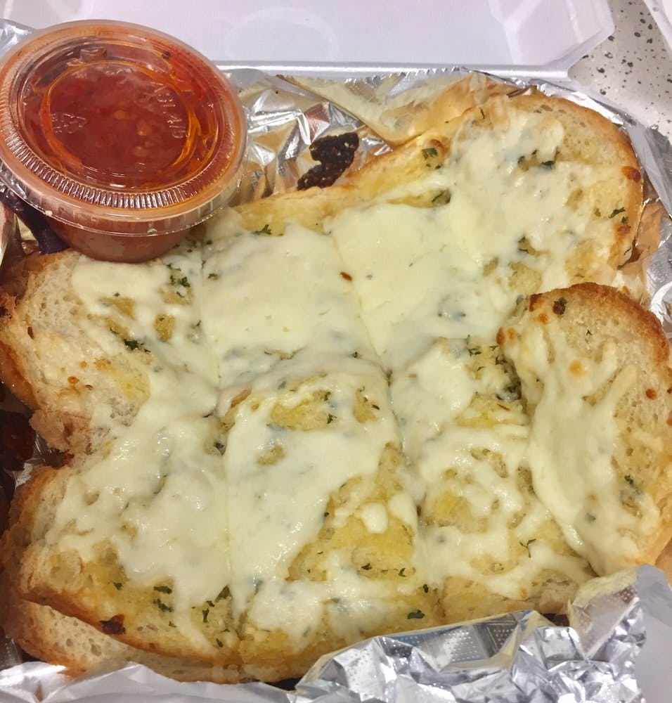 Order Hot Garlic Bread with Cheese - Appetizer food online from Chicagos Pizza store, San Antonio on bringmethat.com