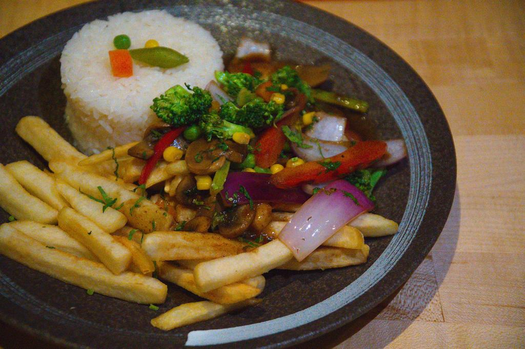 Order FUSION SAUTEED VEGETABLES, FRENCH FRIES, ON BED OF RICE food online from La Furia Chalaca store, Oakland on bringmethat.com