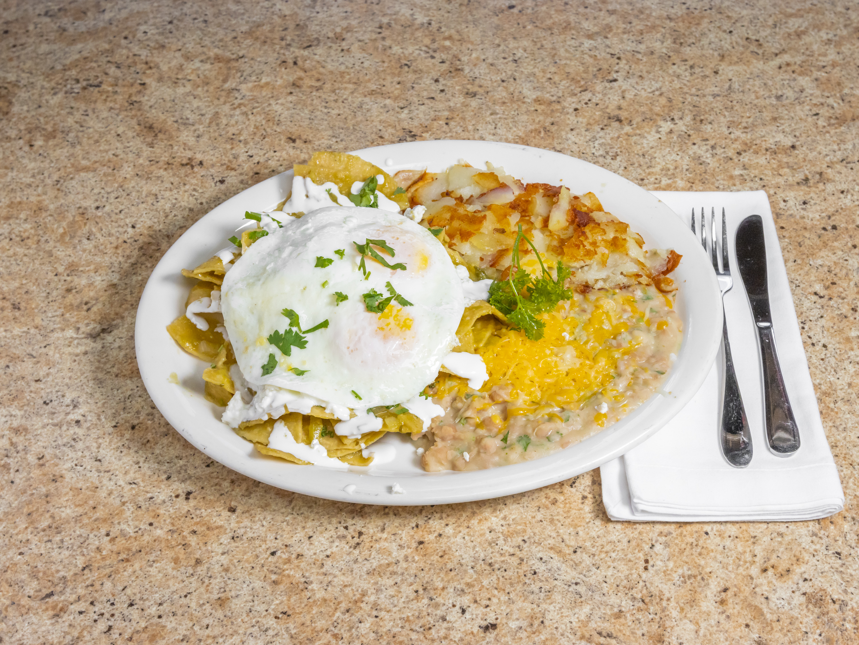 Order Chilaquiles food online from Cinnamon Café store, Montclair on bringmethat.com