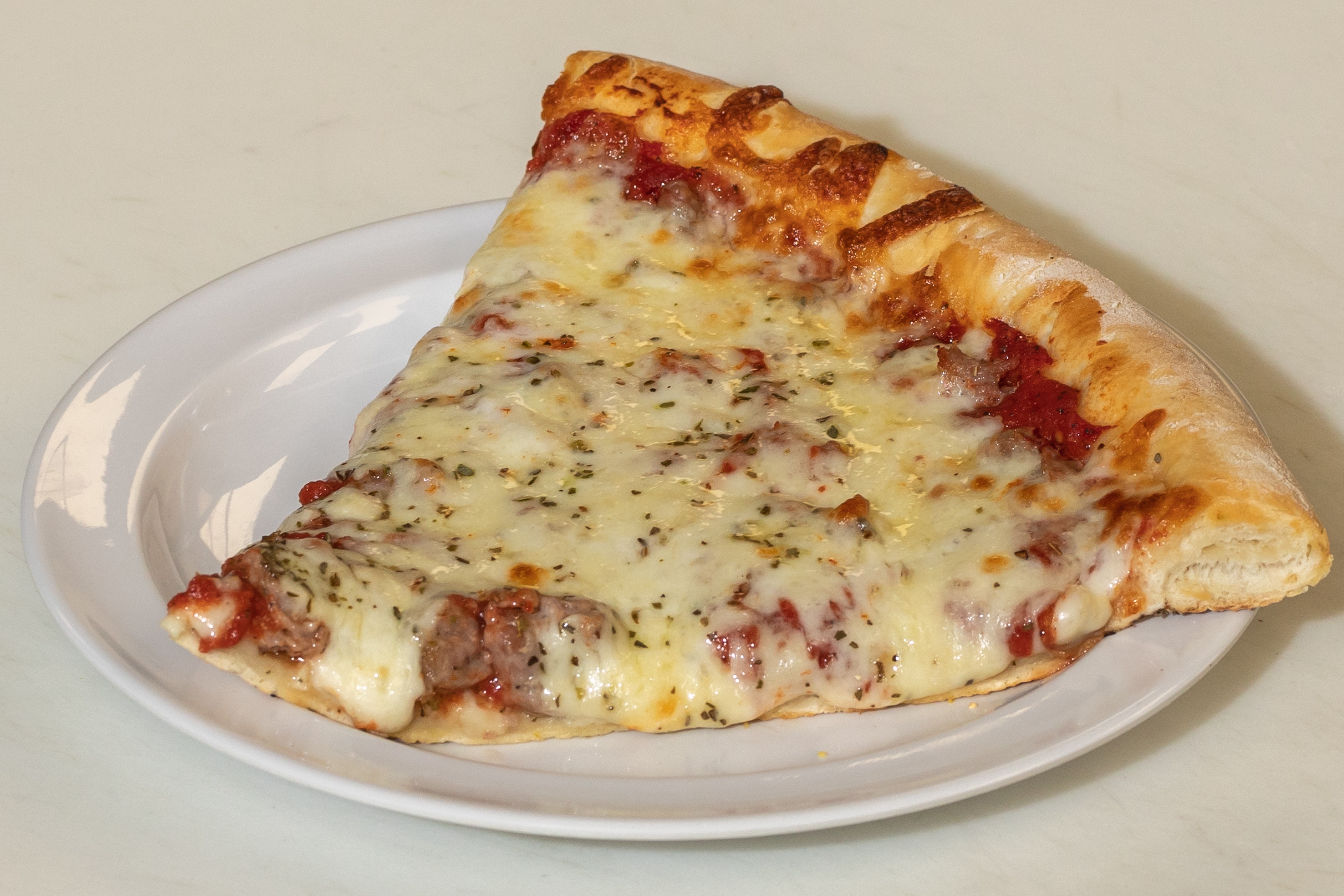 Order Sausage Pizza Slice food online from Tortorice's Pizza & Catering store, Chicago on bringmethat.com
