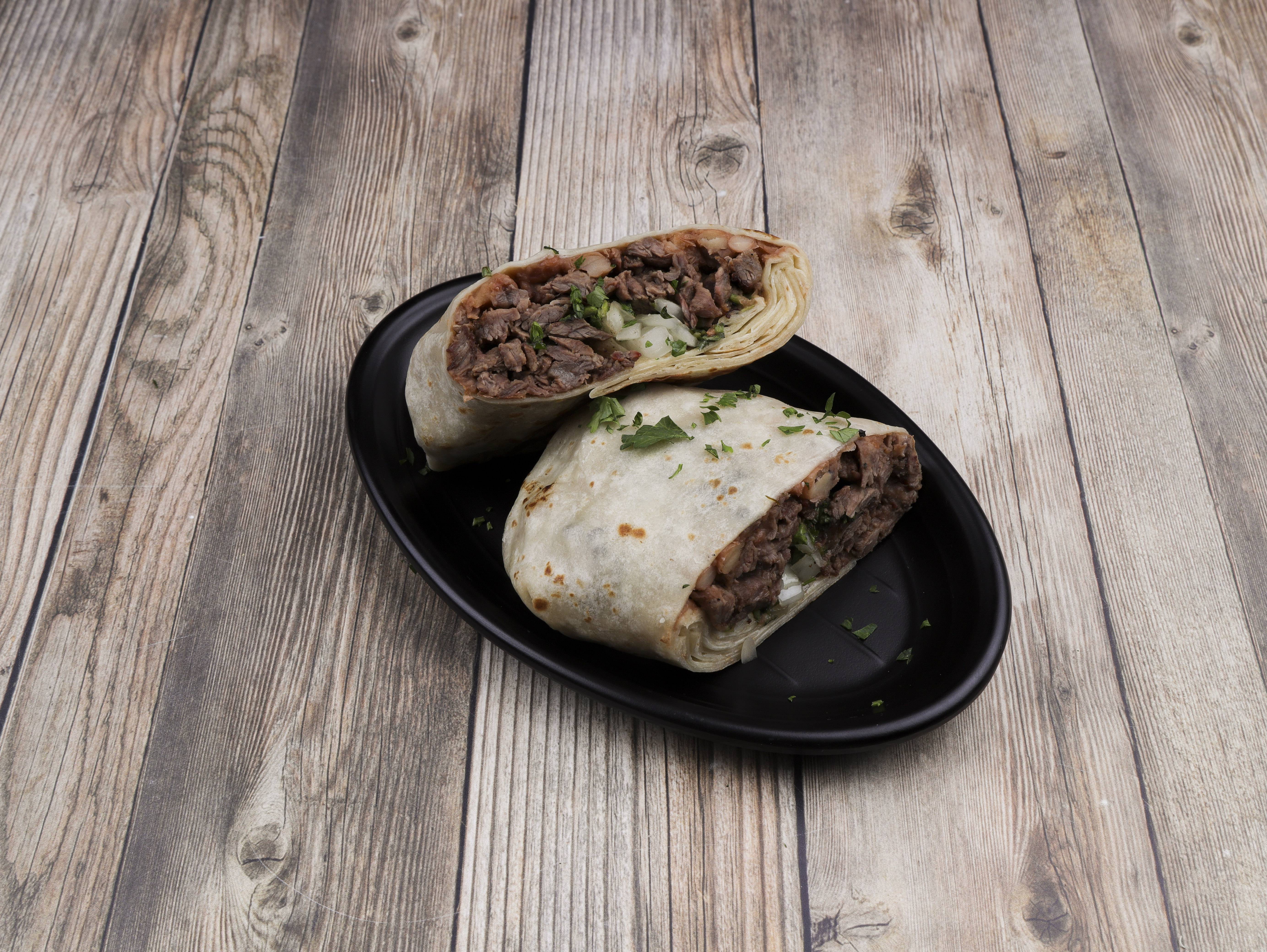 Order Steak Burrito food online from Tixteco Mexican Restaurant store, Omaha on bringmethat.com