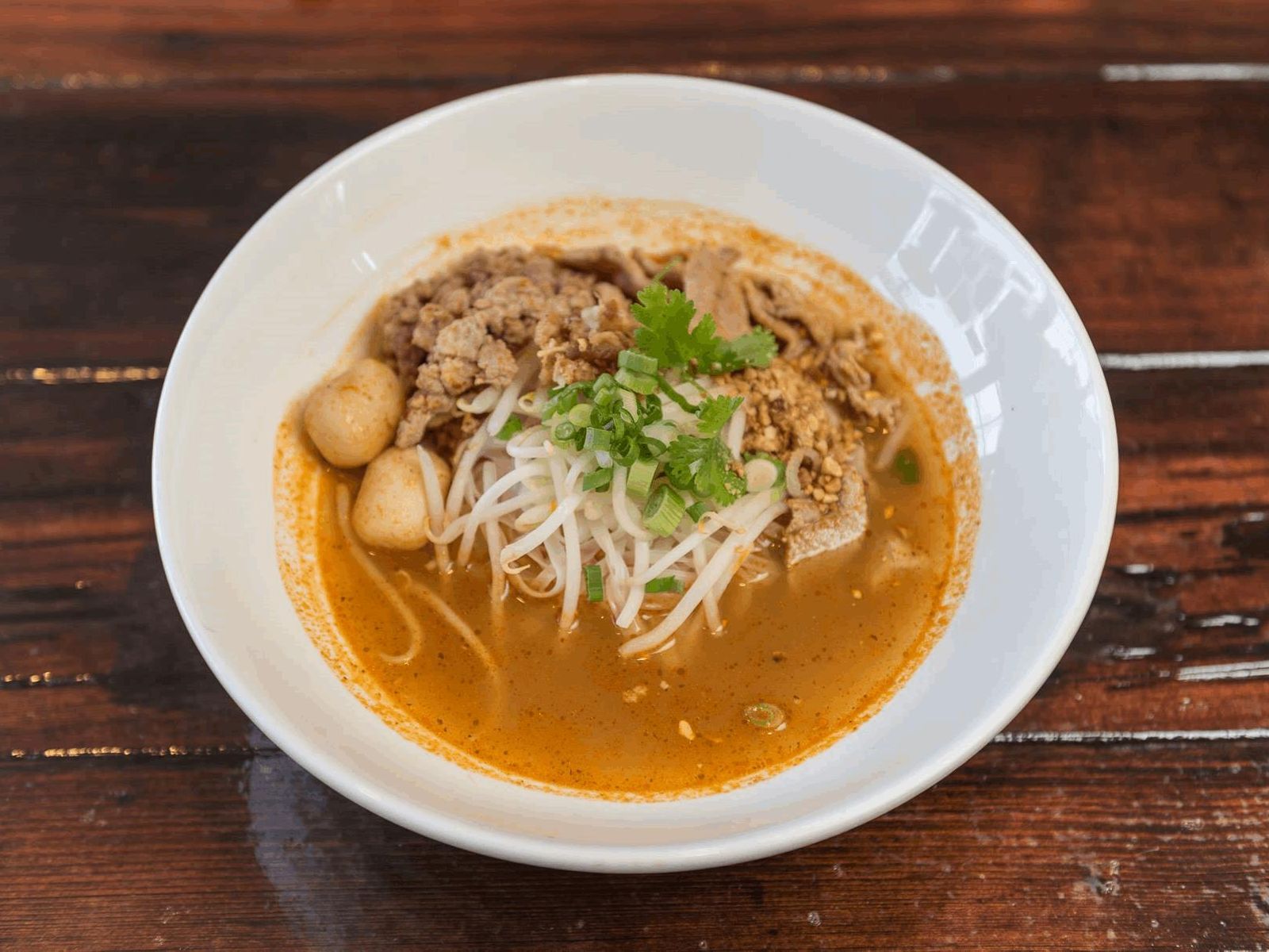 Order Spicy Noodle Soup   food online from Charm Thai Eatery store, San Mateo on bringmethat.com