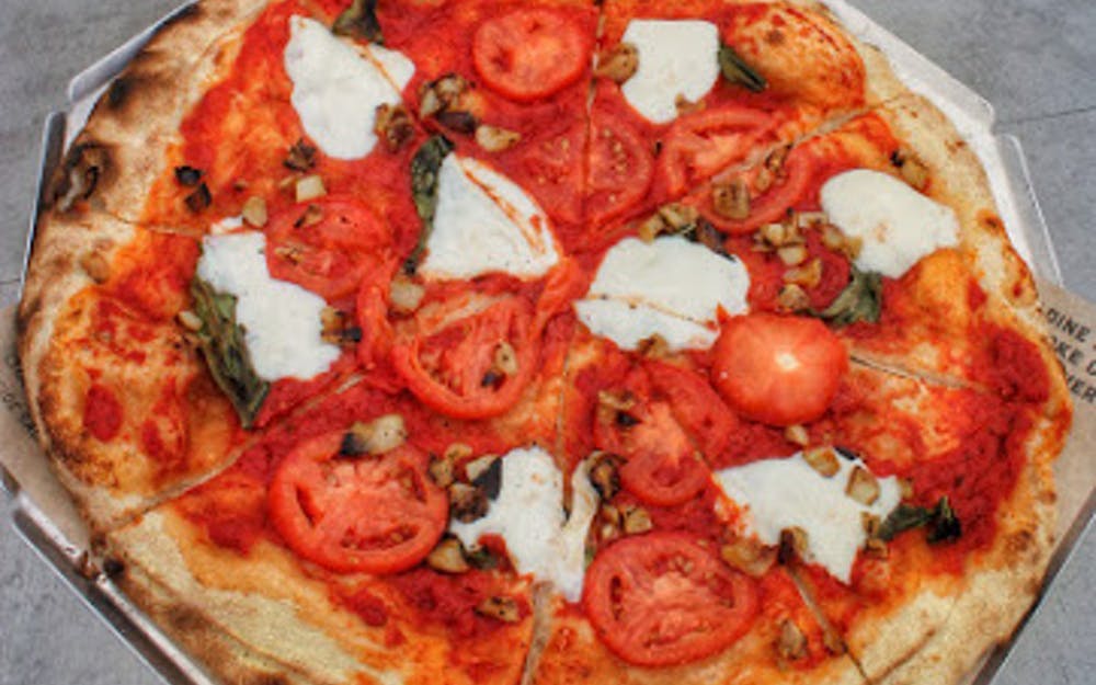 Order Queen Margherita Pizza - Half food online from Urban Bricks store, Lubbock on bringmethat.com