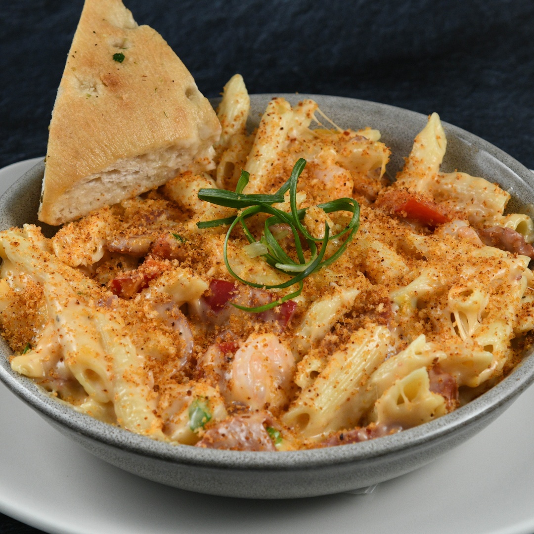 Order Creole Mac N Cheese food online from Rainforest Cafe store, Las Vegas on bringmethat.com