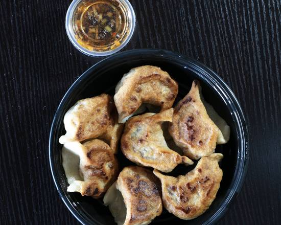 Order Pan-fried Meat Dumplings (7) food online from Red Dragon store, Chandler on bringmethat.com