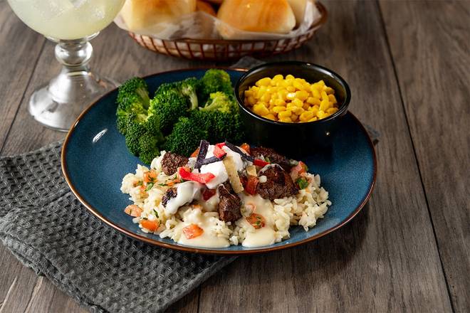 Order Queso Smothered Steak Tips food online from Logan Roadhouse 512 store, Tifton on bringmethat.com