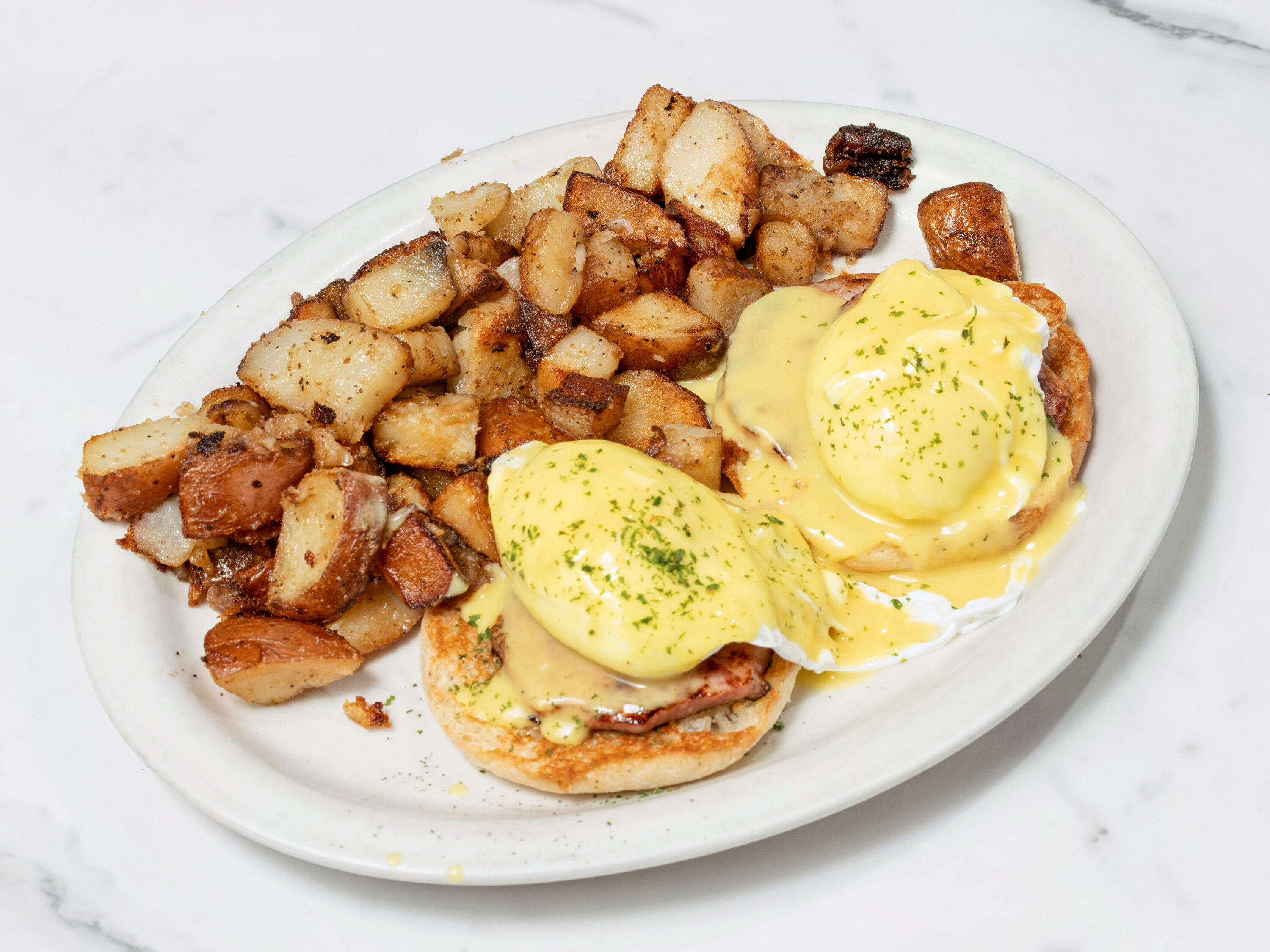 Order Traditional Eggs Benedict food online from Emmily's Restaurant store, Johnston on bringmethat.com
