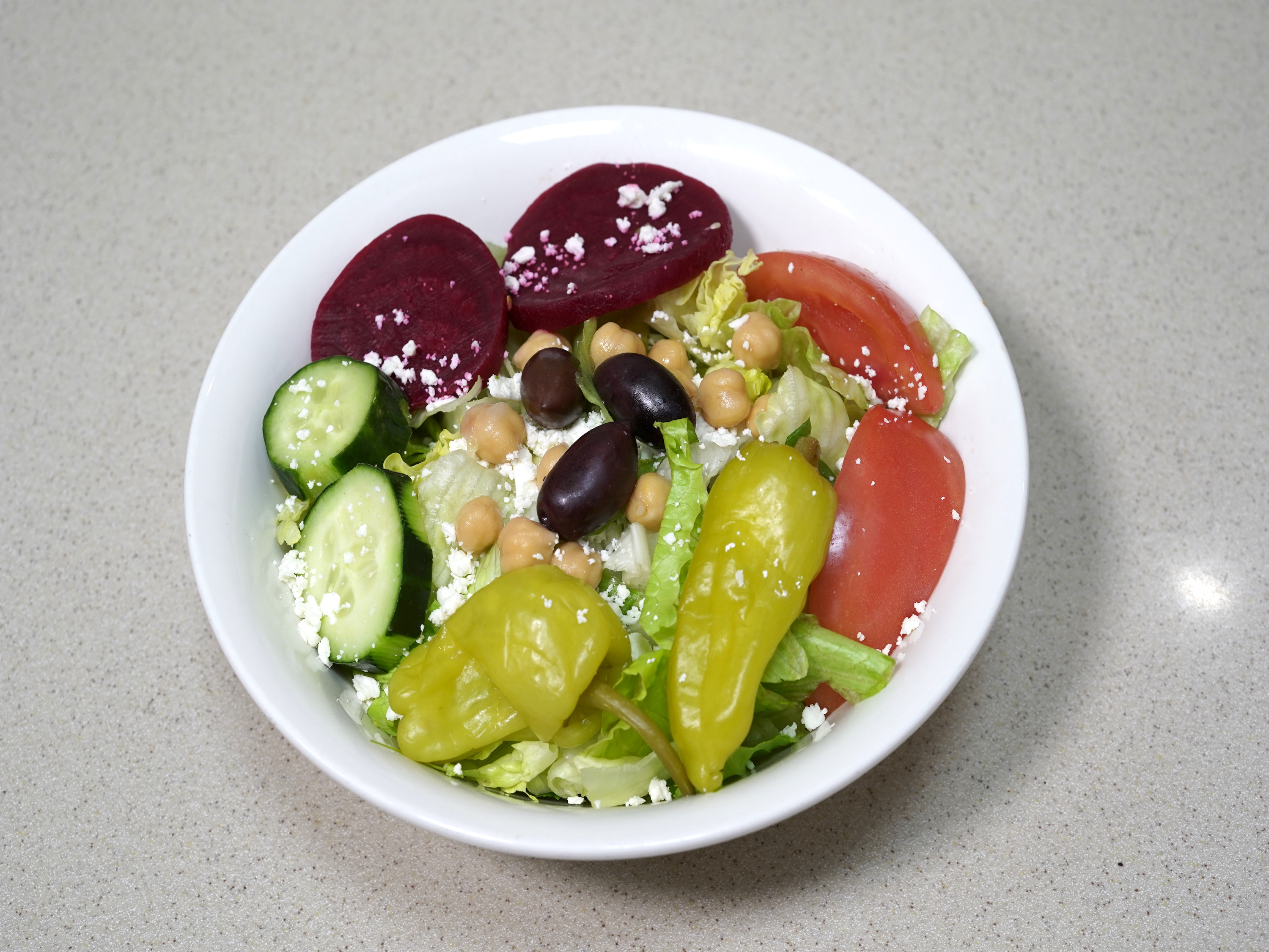 Order Leo's Famous Greek Salad food online from Leo's Coney Island store, South Lyon on bringmethat.com
