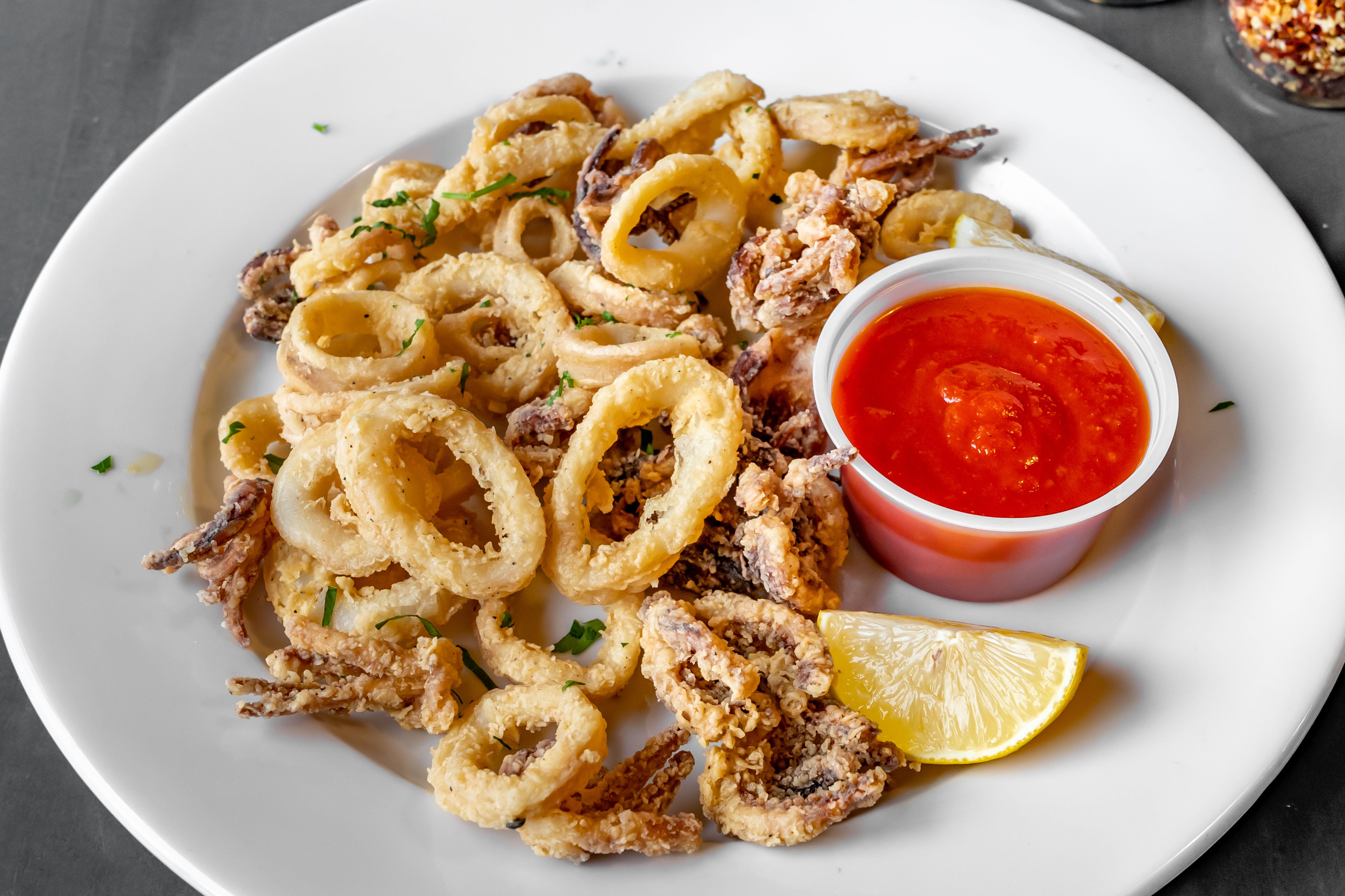 Order Fried Calamari - Appetizer food online from Gino Parlor Of Sandy Hook store, Sandy Hook on bringmethat.com