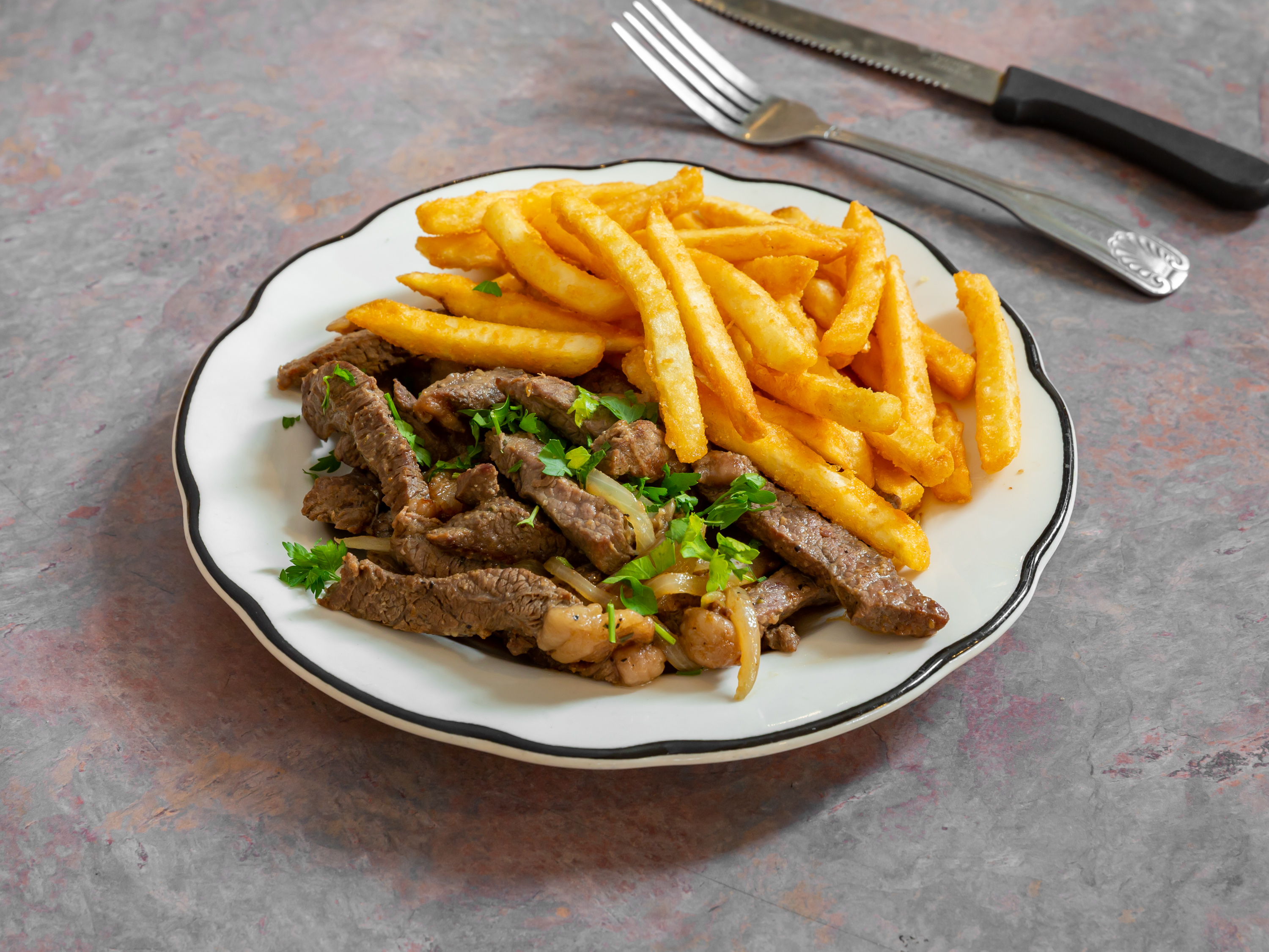 Order Sirloin Steak Tips with Yuca or Fries food online from Oliveiras Peabody store, Peabody on bringmethat.com