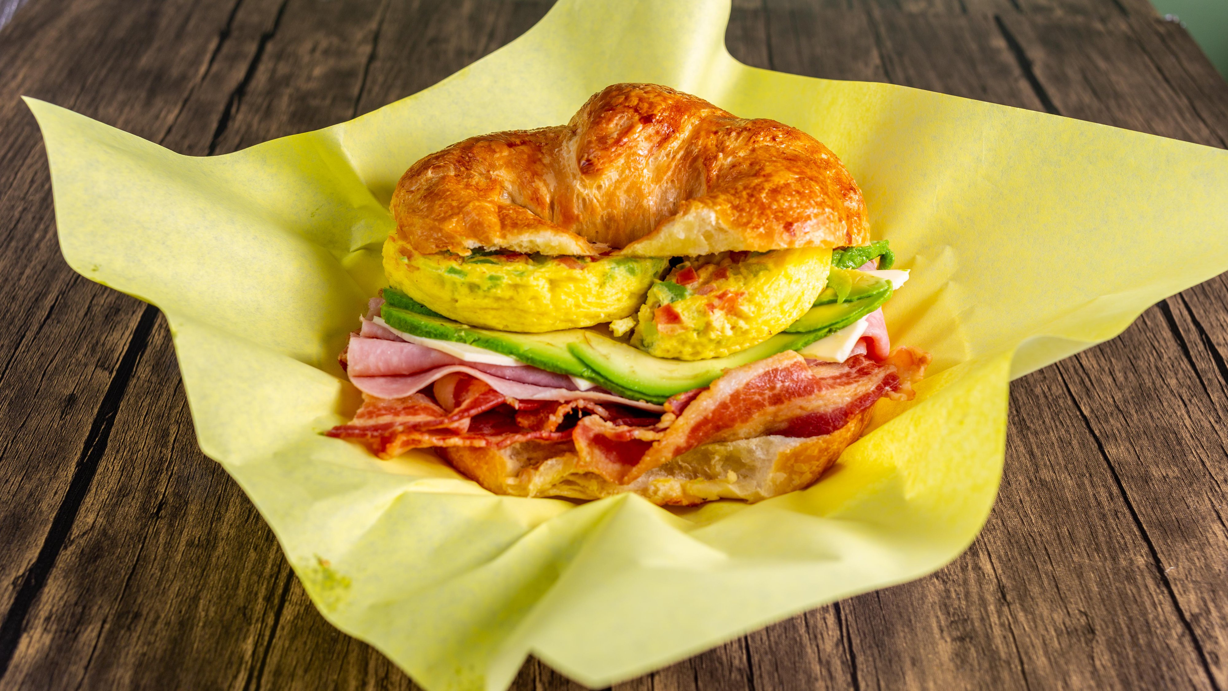 Order A27. Omelette, Ham, Bacon, Avocado, and Cheese Croissant food online from St Boba N Donuts store, Burbank on bringmethat.com