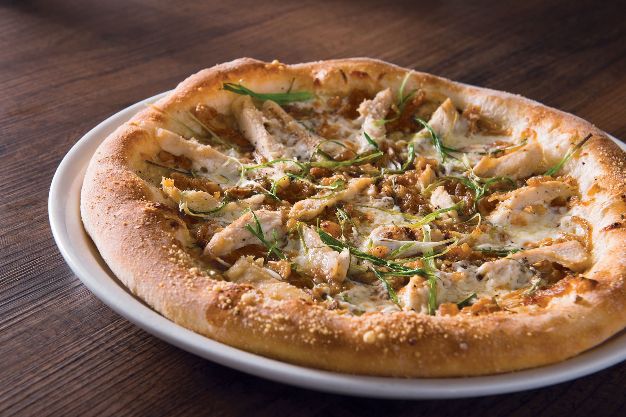 Order Roasted Garlic Chicken Pizza  food online from California Pizza Kitchen - River City Dr store, Jacksonville on bringmethat.com