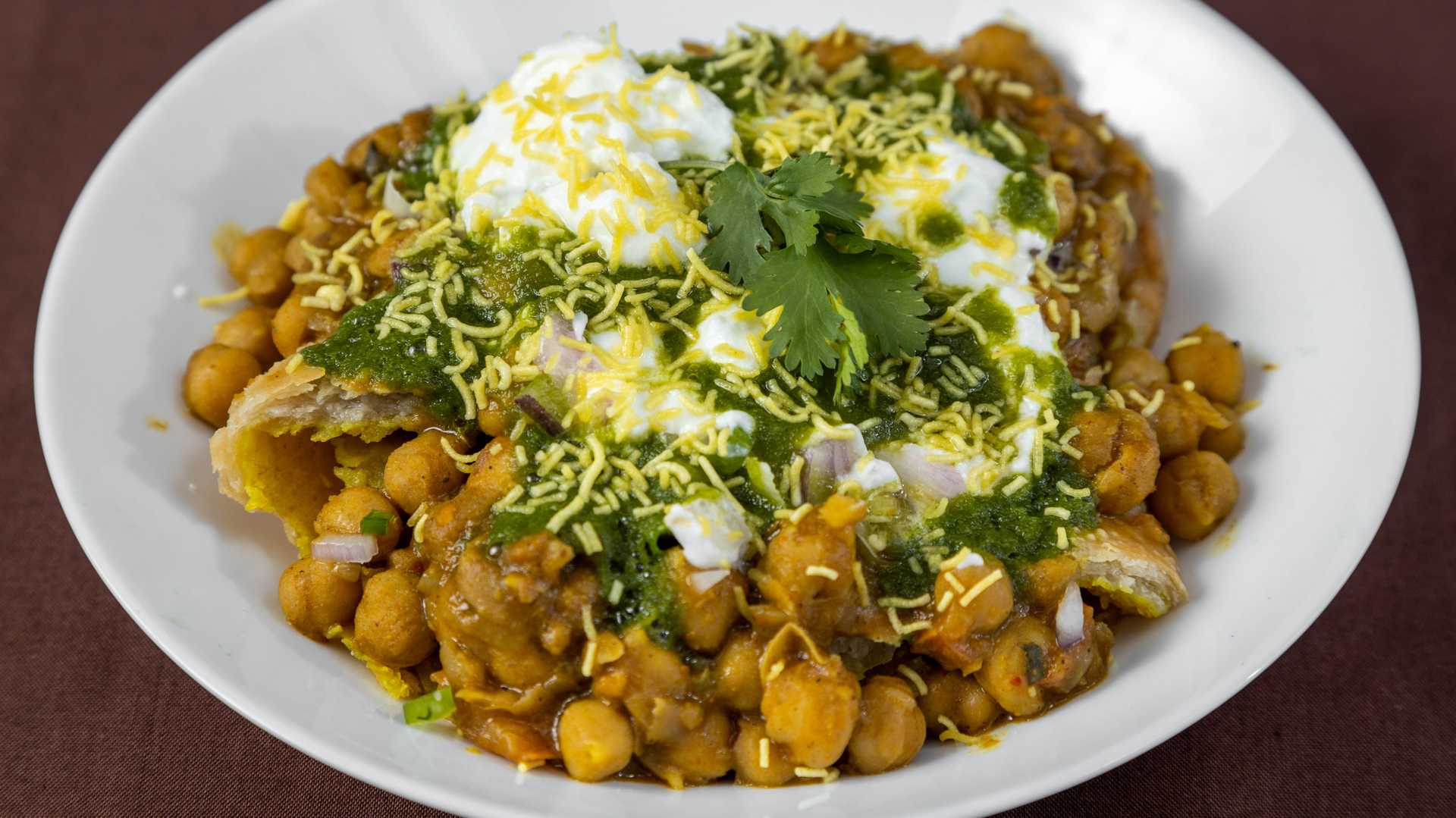 Order Samosa Chaat food online from Curry Hunt store, Chicago on bringmethat.com
