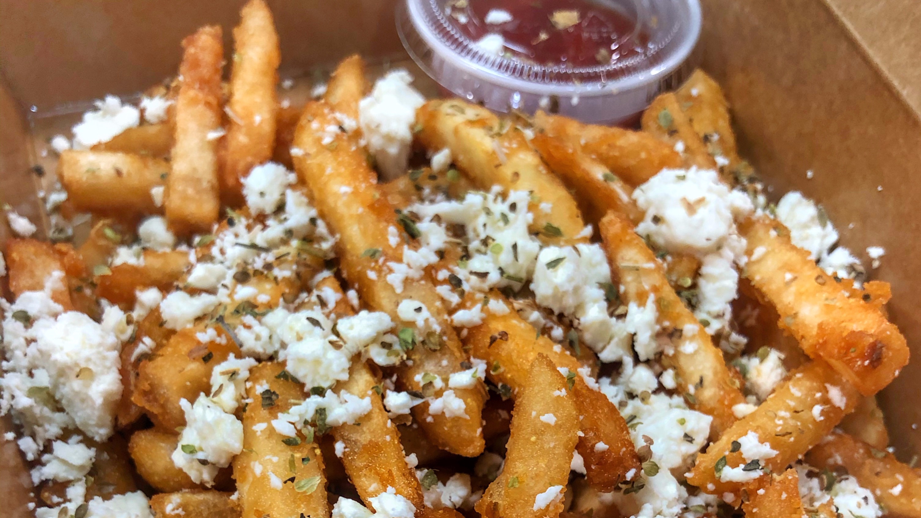 Order Greek Fries food online from 4 Corners Pizza store, Newton Highlands on bringmethat.com