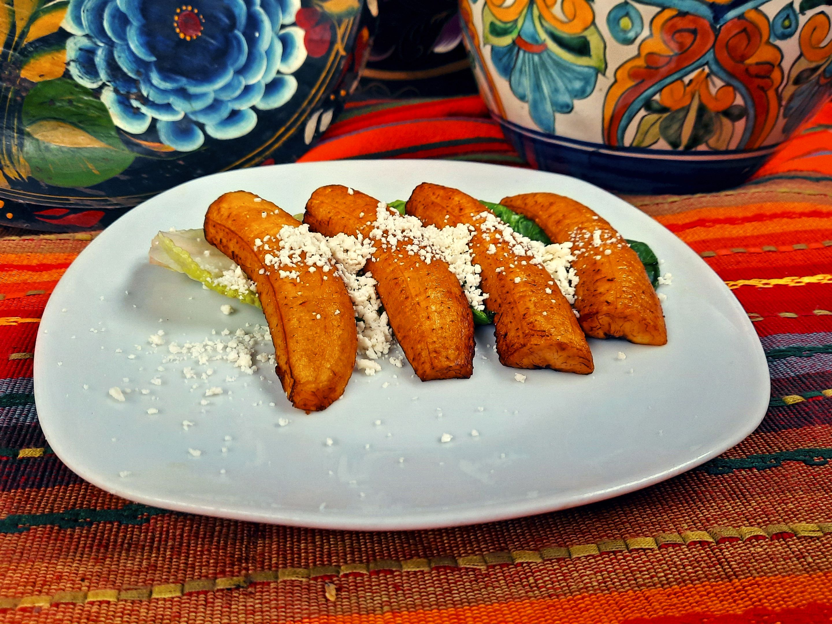 Order Side of Fried Plantain with Queso Fresco food online from Las Bugambilias store, Philadelphia on bringmethat.com