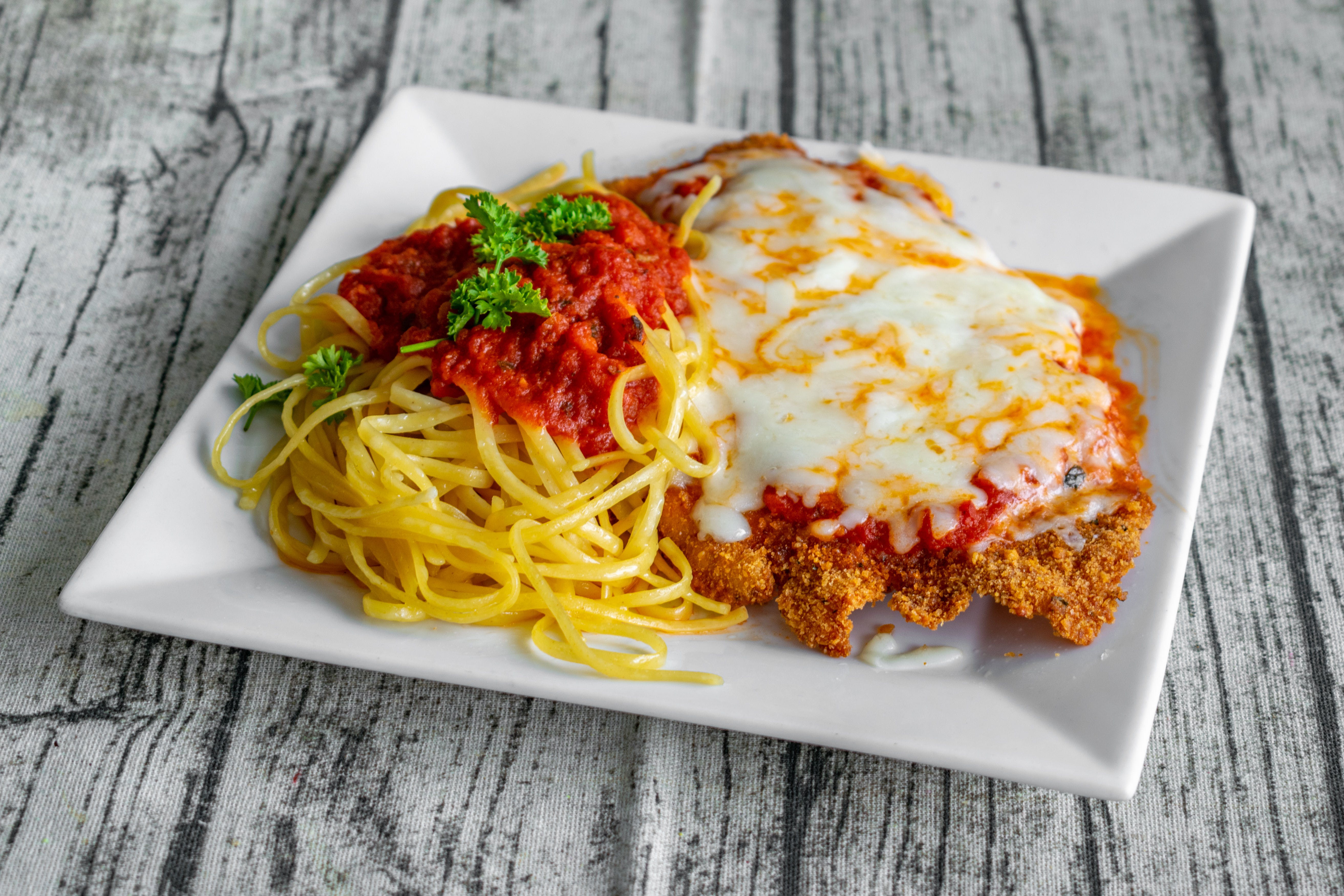 Order Chicken Parm - Entree food online from Biby's Empanadas & Pizza store, Fair Lawn on bringmethat.com