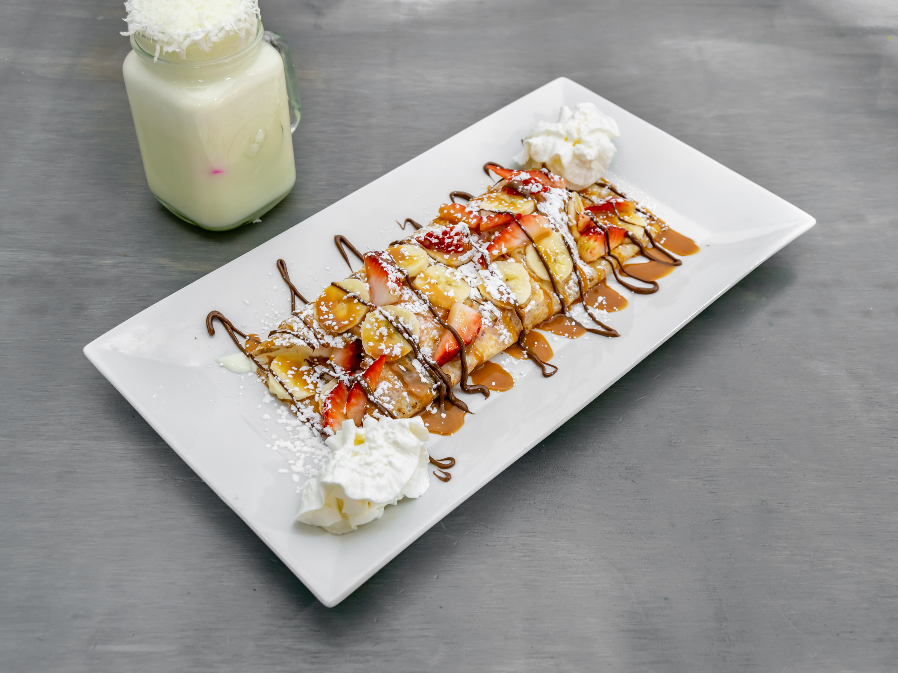 Order Crepes de Fresa  food online from Monchys Colombian Grill store, Dover on bringmethat.com
