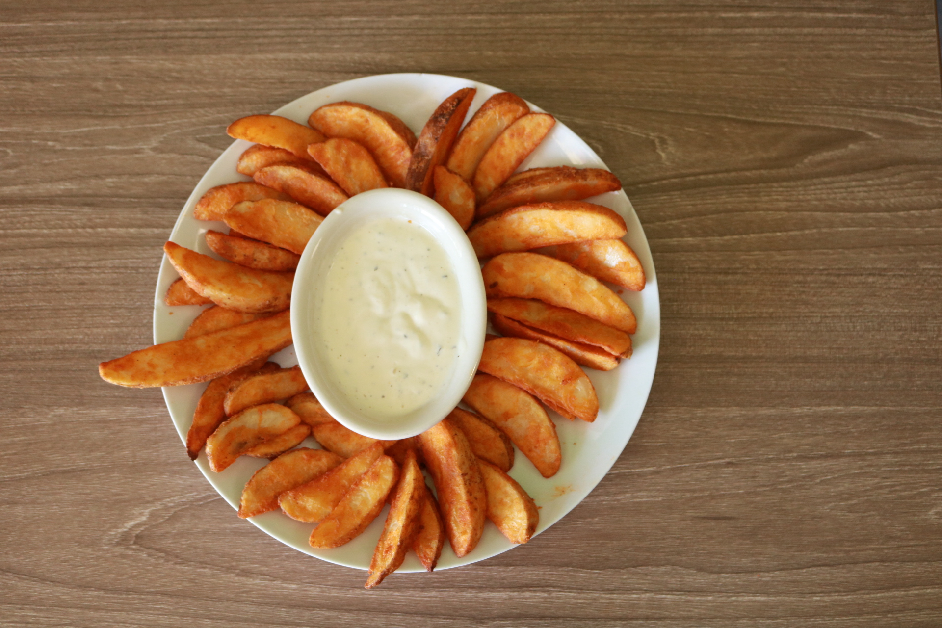 Order 1 lb. Potato Wedges and Side of Ranch food online from Super Pizza Veloz store, Bell Gardens on bringmethat.com