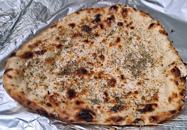Order Garlic Basil Naan food online from Flavours Of India store, Gresham on bringmethat.com