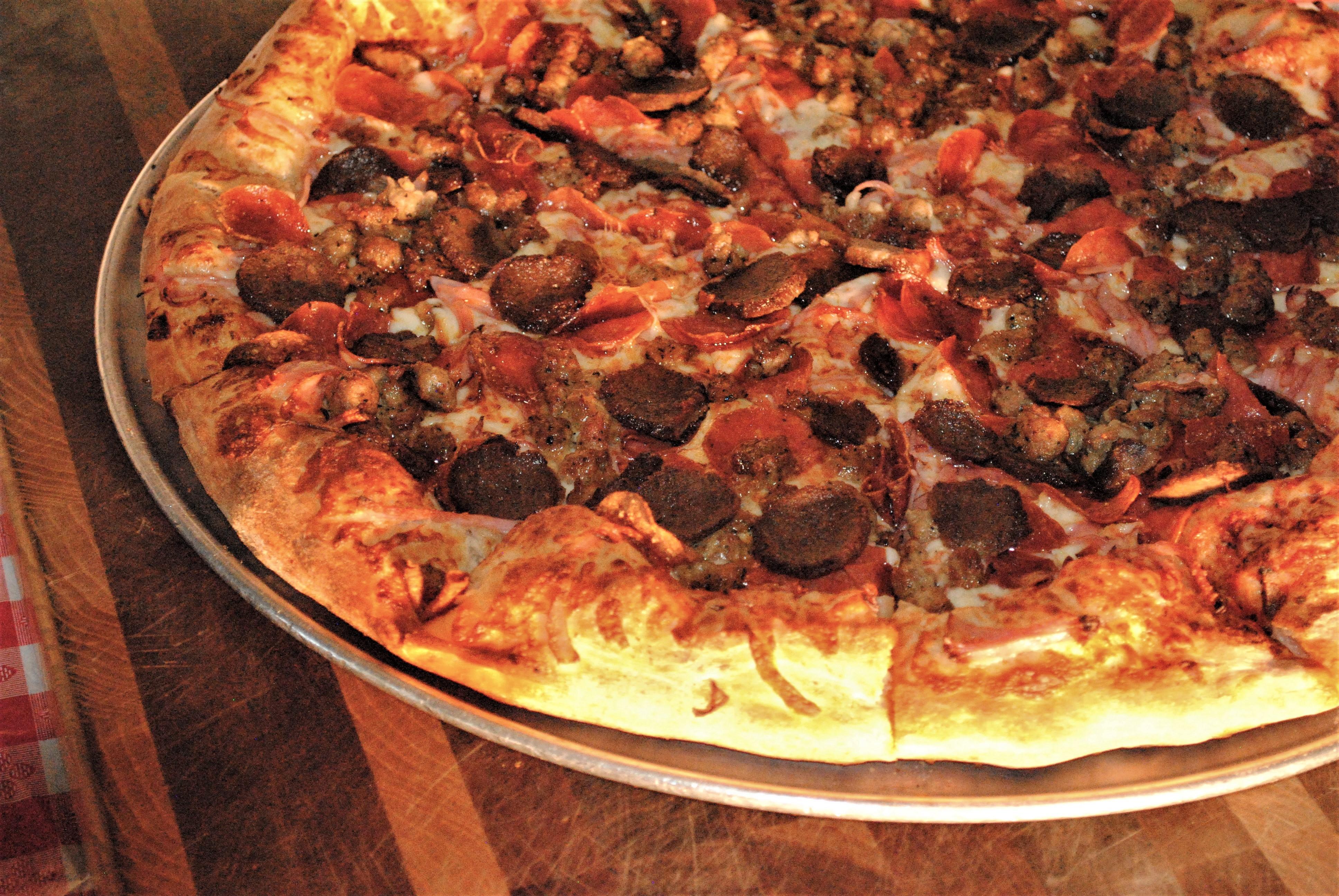 Order Medium 18" Meat Lover's Pizza - 10 Slices food online from Vincenzo's Pizza Newhall store, Newhall on bringmethat.com