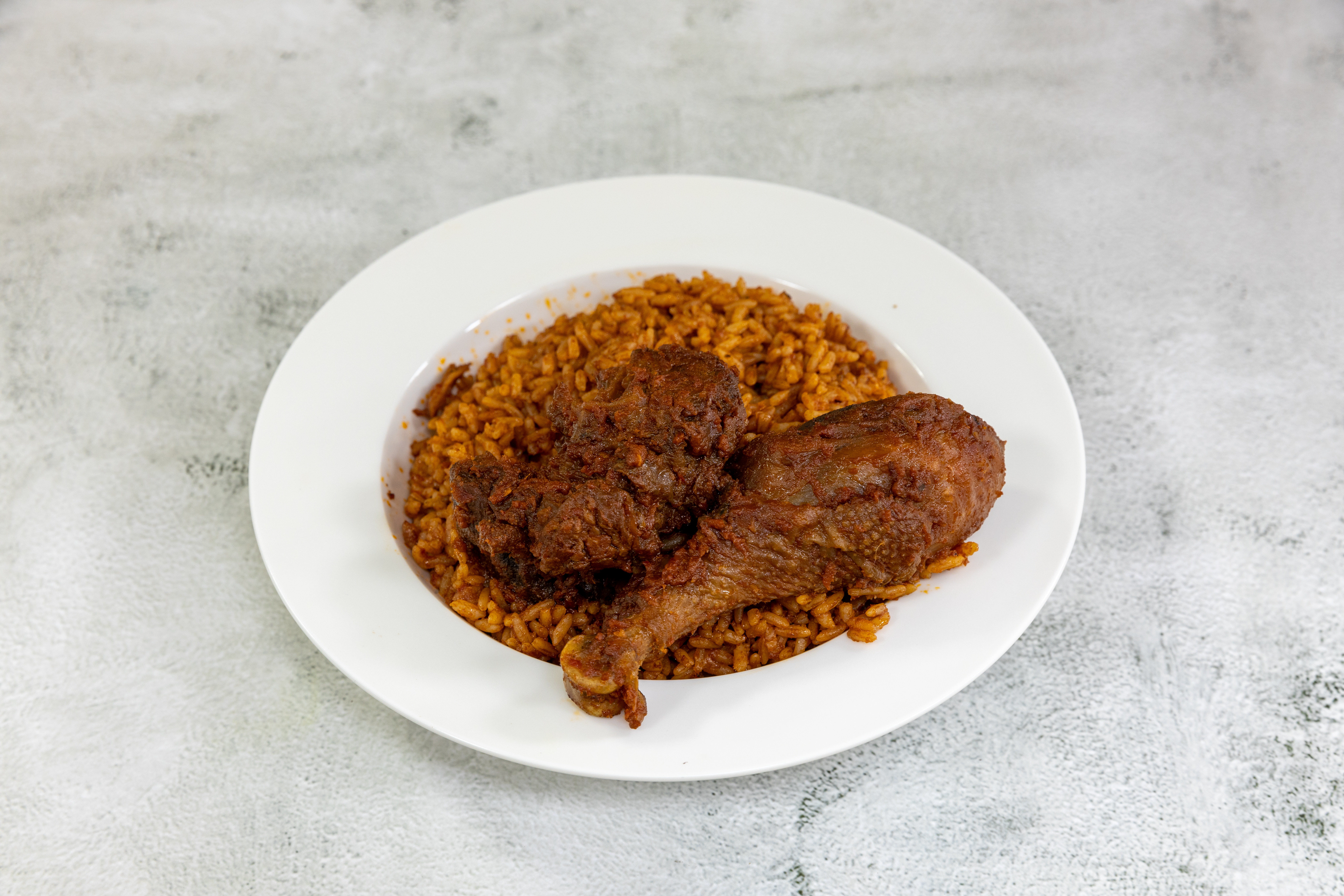 Order Jollof Rice food online from Remmy Eatery store, Houston on bringmethat.com